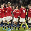 Manchester United's Marcus Rashford, center, celebrates with teammates after scoring his side's first goal during the English Premier League soccer match between Manchester United and West Ham at Old Trafford stadium in Manchester, England, Saturday, Jan. 22, 2022. (AP Photo/Dave Thompson)
