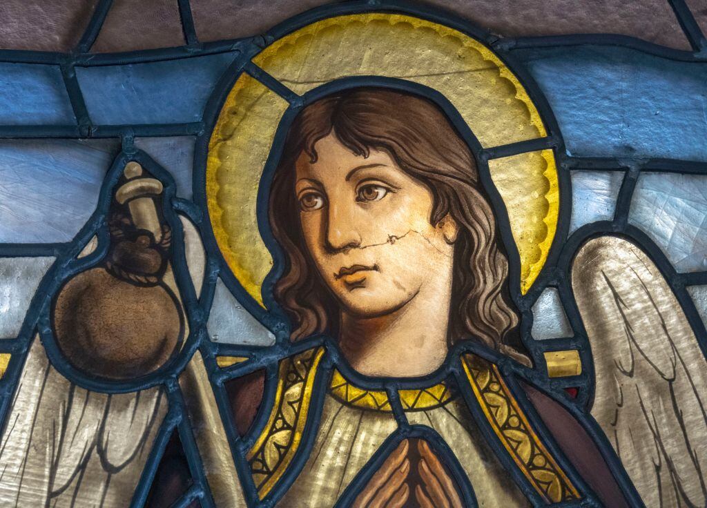 Stained glass window featuring (possibly) the Archangel Raphael who is said to guard travelers. La Rabida Monastery, Palos de la Frontera, Huelva Province, Andalusia, southern Spain. The monastery was founded in 1261. It is remembered now as the place Christopher Columbus visited when planning his epic voyage. (Photo by: Ken Welsh/UCG/Universal Images Group via Getty Images)