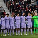 The Barcelona soccer team gathers ahead of the start of the La Liga soccer match between Osasuna and FC Barcelona at the El Sadar stadium in Pamplona, Spain, Sunday, Dec. 12, 2021. (AP Photo/Alvaro Barrientos)