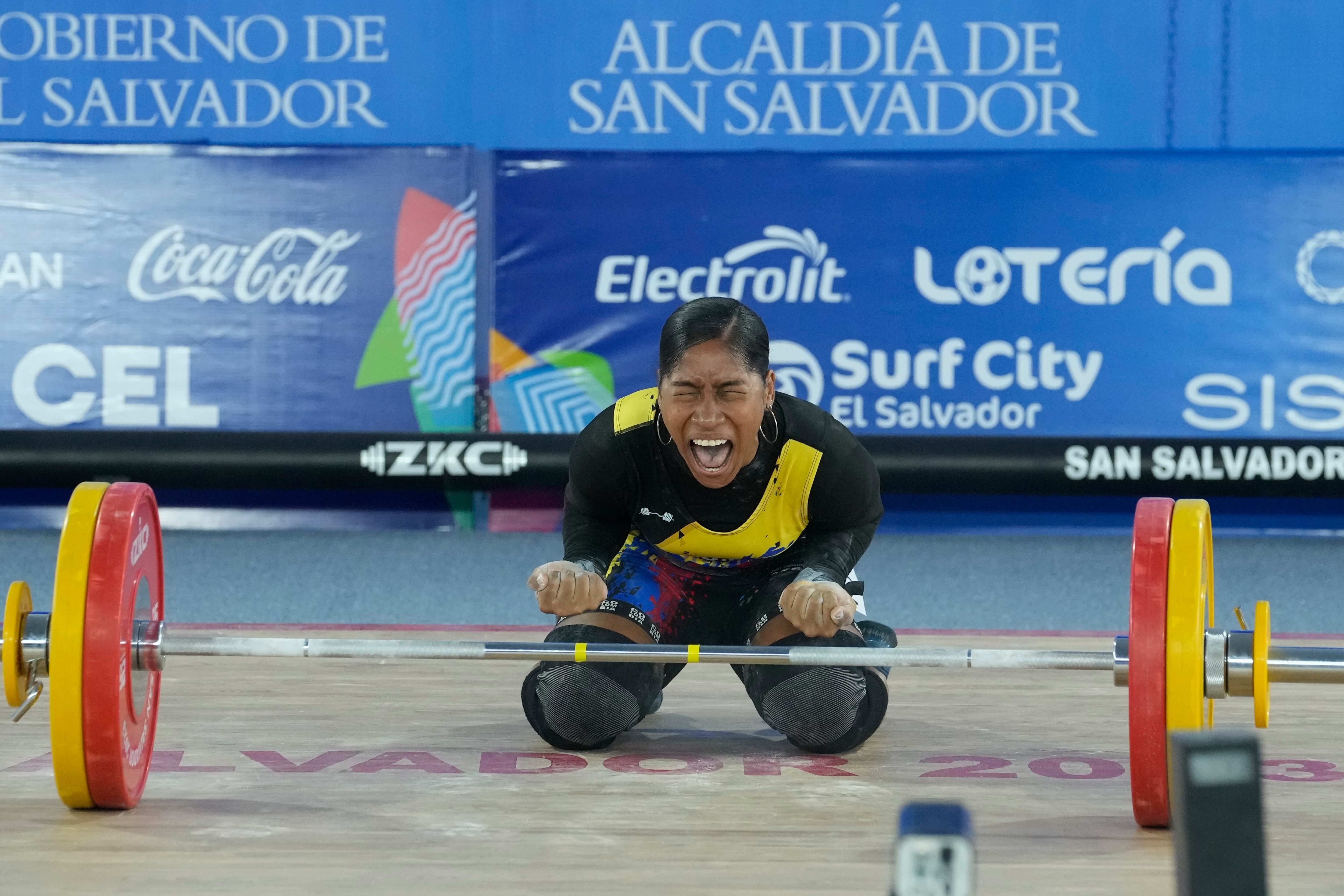 Colombia's Julieth Rodriguez competes in the women's 64kg weightlifting final round at the Central American and Caribbean Games in San Salvador, El Salvador, Sunday, June 25, 2023. (AP Photo/Arnulfo Franco)