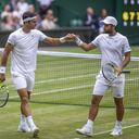 LONDON, ENGLAND - July 13: Robert Farah of Colombia and Juan Sebastian Cabal of Colombia in action against Nicolas Mahut of France and Edouard Roger-Vasselin of France in the Men's Doubles Final on Centre Court during the Wimbledon Lawn Tennis Championships at the All England Lawn Tennis and Croquet Club at Wimbledon on July 13, 2019 in London, England. (Photo by Tim Clayton/Corbis via Getty Images)