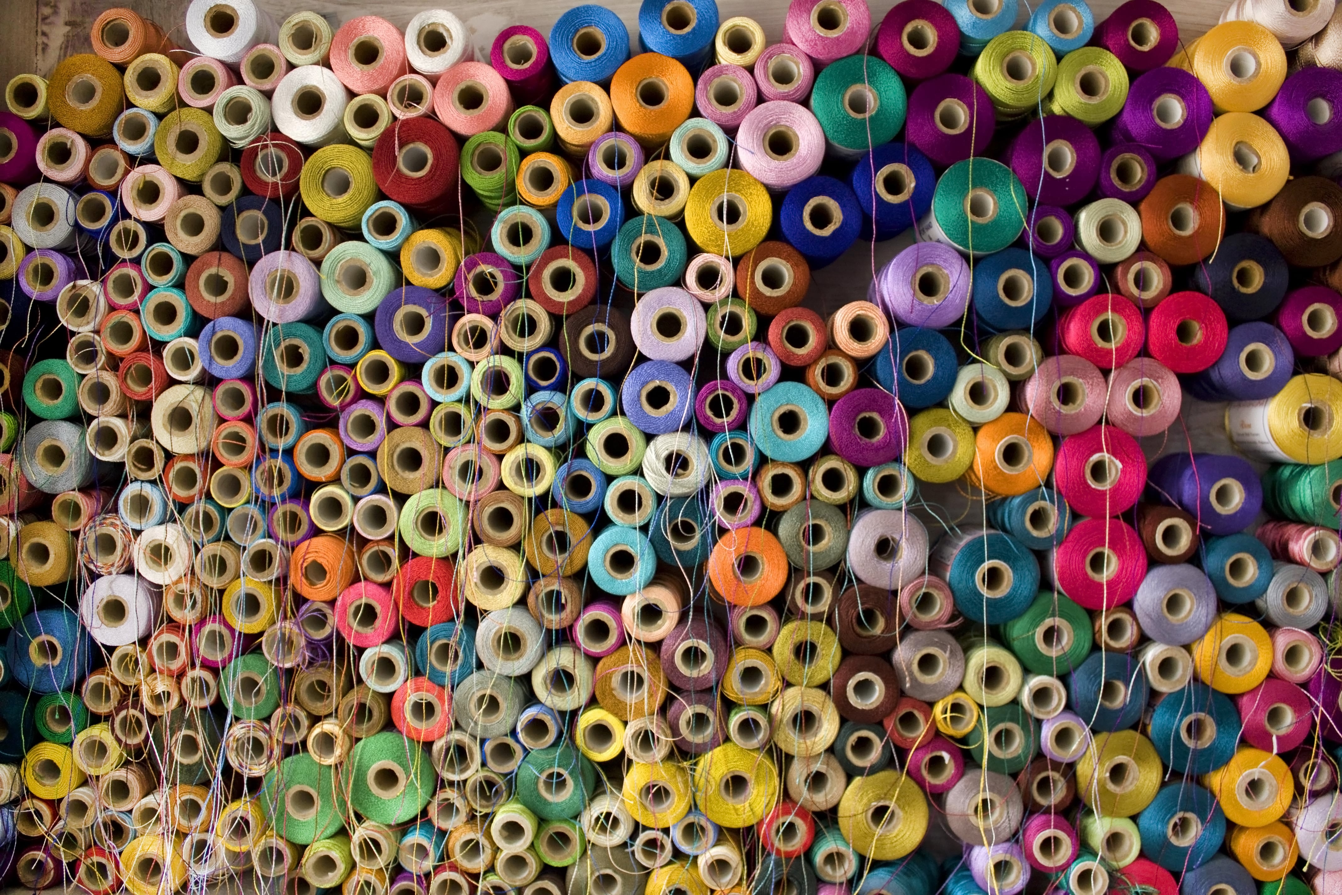 Colorful cotton and silk thread reels.