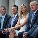 FILE - Donald Trump, right, sits with his children, from left, Eric Trump, Donald Trump Jr., and Ivanka Trump during a groundbreaking ceremony for the Trump International Hotel on July 23, 2014, in Washington. A New York appeals court dismissed Ivanka Trump on Tuesday, June 27, 2023, from a wide-ranging fraud lawsuit brought against her father and his company last year by the state's attorney general. (AP Photo/Evan Vucci, File)