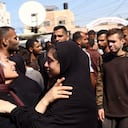 Palestinians react outside the al-Aqsa Martyrs hospital after an Israeli strike hit a school housing displaced people in Deir al-Balah in the central Gaza Strip, on October 10, 2024, amid the ongoing war between Israel and Hamas. The Palestinian Red Crescent said an Israeli air strike on a Gaza school killed at least 28 people on October 10, while the Israeli military reported it struck a Hamas command centre. The Israeli army said in a statement the strike targeted Palestinian combatants operating from a command-and-control centre "embedded inside a compound that previously served as the (Rafida) School". (Photo by Eyad BABA / AFP)