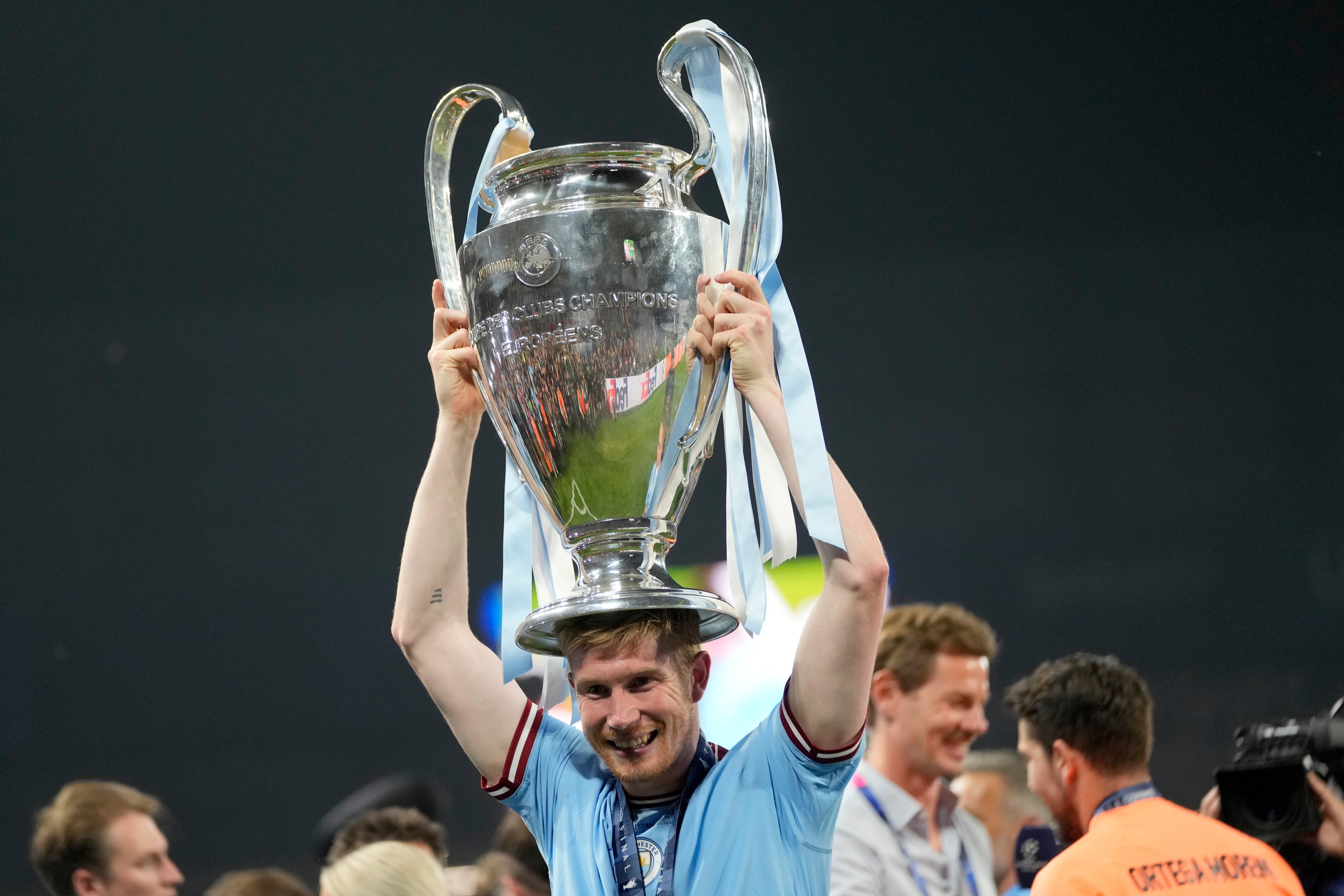 FILE - Manchester City's Kevin De Bruyne celebrates with the trophy after winning the Champions League final soccer match between Manchester City and Inter Milan at the Ataturk Olympic Stadium in Istanbul, Turkey, Sunday, June 11, 2023.  (AP Photo/Francisco Seco, file)