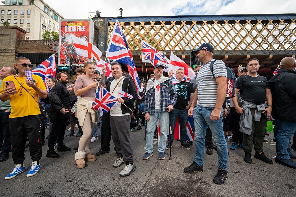 LONDON, ENGLAND - SEPTEMBER 13: Crowds gather during the Unite The Kingdom rally in Central London on September 13, 2025 in London, England. Far-right activist Tommy Robinson (also known as Stephen Yaxley-Lennon) has invited supporters to hold a rally in central London entitled "Unite The Kingdom". The former English Defence League leader and his supporters are actively islamaphobic and racist and have been behind much of the unrest seen outside hotels housing migrants this summer. Stand Up To Racism are mounting a counter-protest to today's rally. (Photo by Ben Montgomery/Getty Images)
