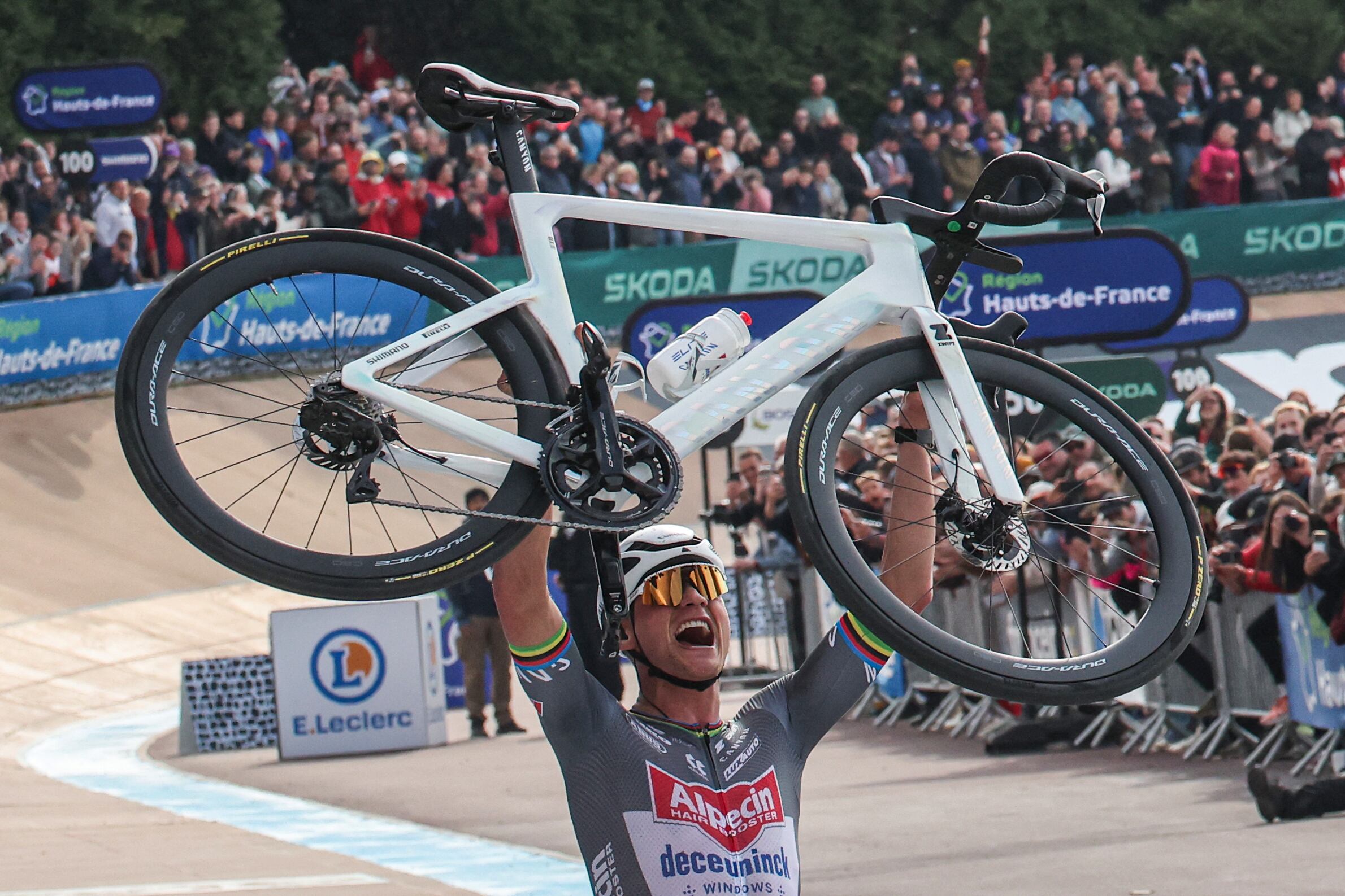 Alpecin-Deceuninck's Dutch rider Mathieu van der Poel celebrates after crossing the finish line to win the 122nd edition of the Paris-Roubaix one-day classic cycling race, 259,2 km between Compiegne and Roubaix, at the V�lodrome Andr�-P�trieux in Roubaix, northern France on April 13, 2025. (Photo by Francois LO PRESTI / AFP)