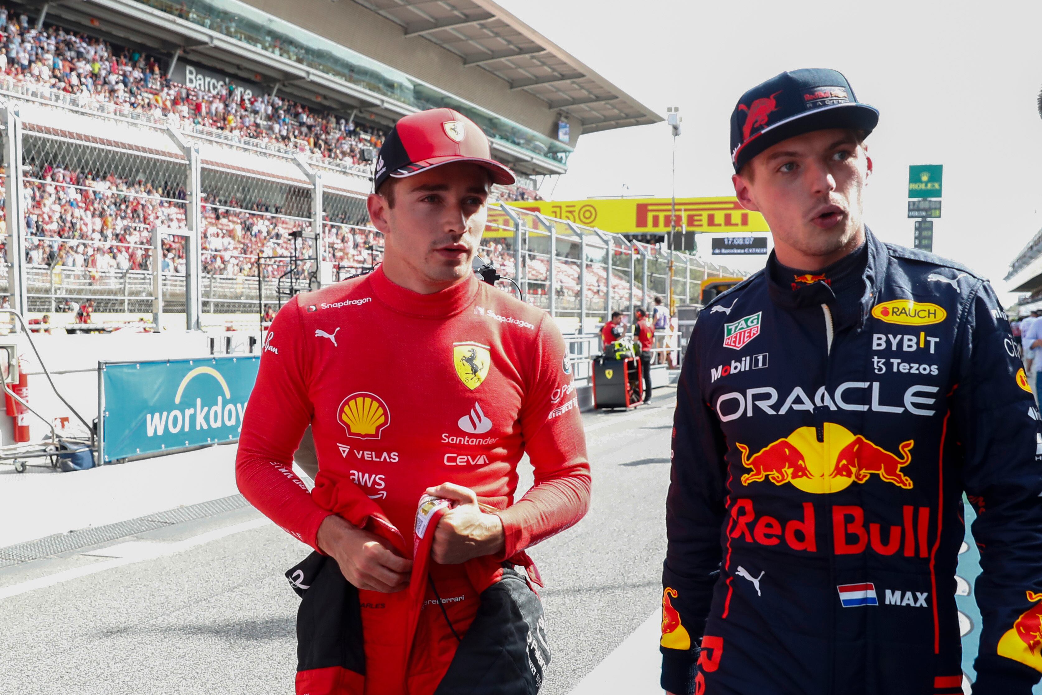 Ferrari driver Charles Leclerc of Monaco, left, pole position, is flanked by second fastest time Red Bull driver Max Verstappen of the Netherlands after the qualifying session at the Barcelona Catalunya racetrack in Montmelo, Spain, Saturday, May 21, 2022. The Formula One race will be held on Sunday. (AP Photo/Joan Monfort)