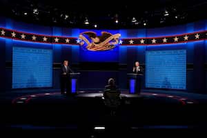 President Donald Trump, left, and Democratic presidential candidate former Vice President Joe Biden, right, during the first presidential debate with moderator Chris Wallace of Fox News, center, Tuesday, Sept. 29, 2020, at Case Western University and Cleveland Clinic, in Cleveland, Ohio. (AP Photo/Patrick Semansky)