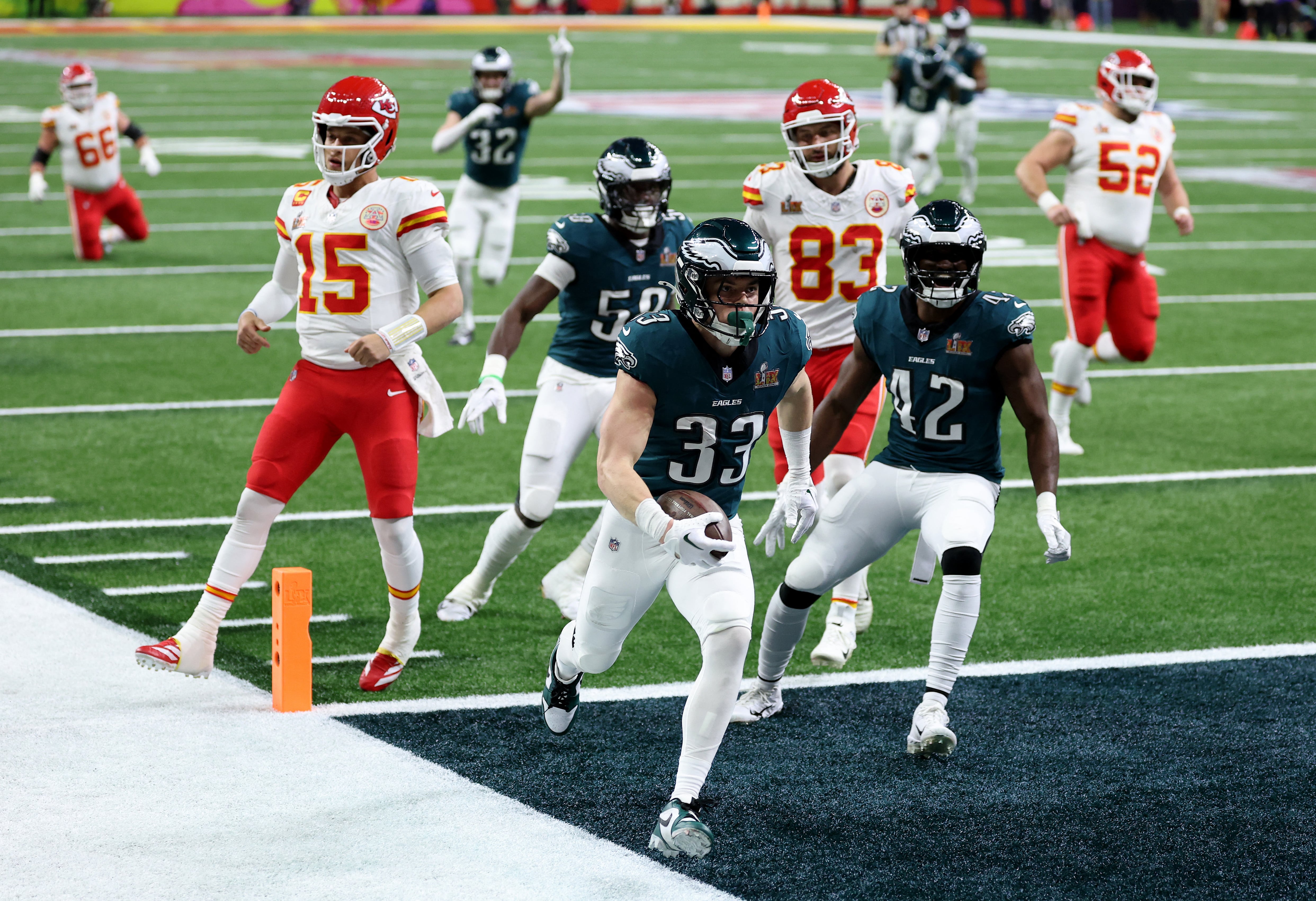 NEW ORLEANS, LOUISIANA - FEBRUARY 09: Cooper DeJean #33 of the Philadelphia Eagles scores a touchdown past Patrick Mahomes #15 of the Kansas City Chiefs after making an interception in the second quarter during Super Bowl LIX at Caesars Superdome on February 09, 2025 in New Orleans, Louisiana. Emilee Chinn/Getty Images/AFP (Photo by Emilee Chinn / GETTY IMAGES NORTH AMERICA / Getty Images via AFP)