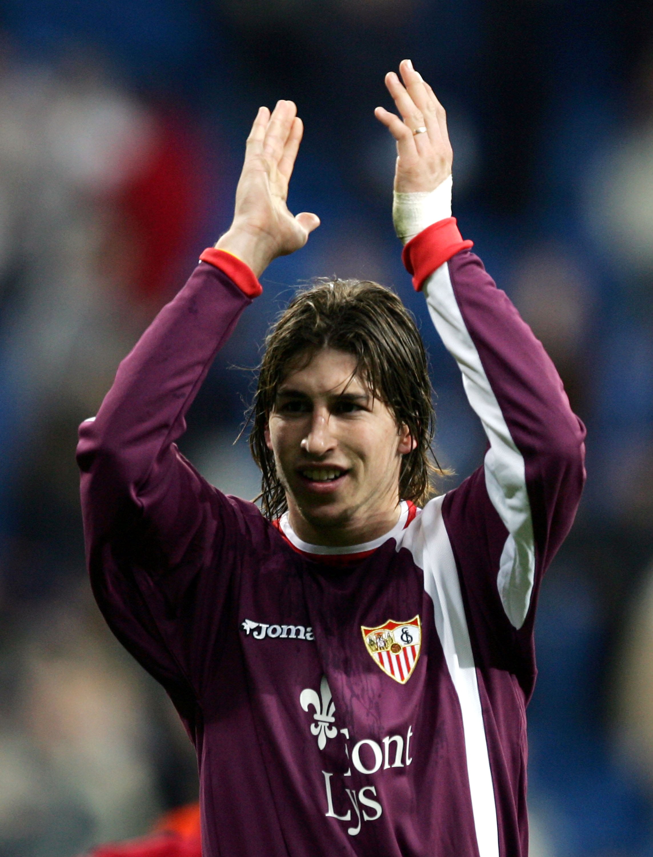 MADRID, SPAIN - DECEMBER 22: Sevilla's Sergio Ramos salutes fans after beating Real Madrid 1-0 during the Primera Liga match between Real Madrid and Sevilla at the Bernabeu on December 22, 2004 in Madrid, Spain. (Photo by Denis Doyle/Getty Images)