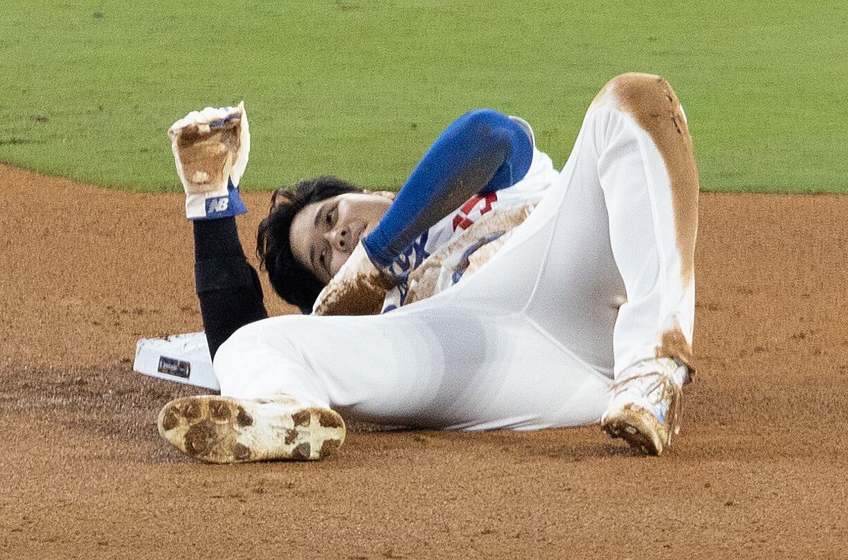 Los Angeles, CA - October 26: Dodgers star Shohei Ohtani sustains a shoulder injury while trying to seal second base during the seventh inning of the Dodgers' 4-2 win over the Yankees in Game 2 of the World Series at Dodger Stadium on Saturday night.    (Allen J. Schaben / Los Angeles Times via Getty Images)