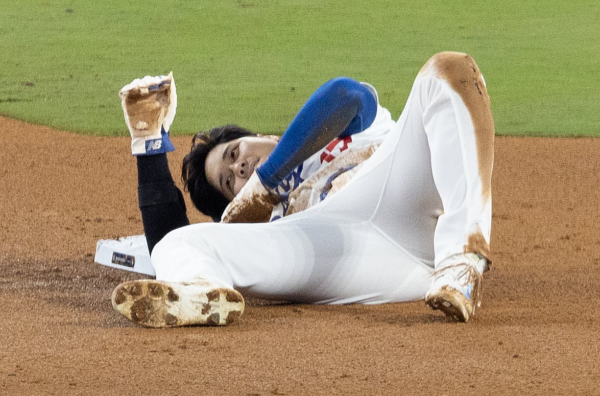 Los Angeles, CA - October 26: Dodgers star Shohei Ohtani sustains a shoulder injury while trying to seal second base during the seventh inning of the Dodgers' 4-2 win over the Yankees in Game 2 of the World Series at Dodger Stadium on Saturday night.    (Allen J. Schaben / Los Angeles Times via Getty Images)