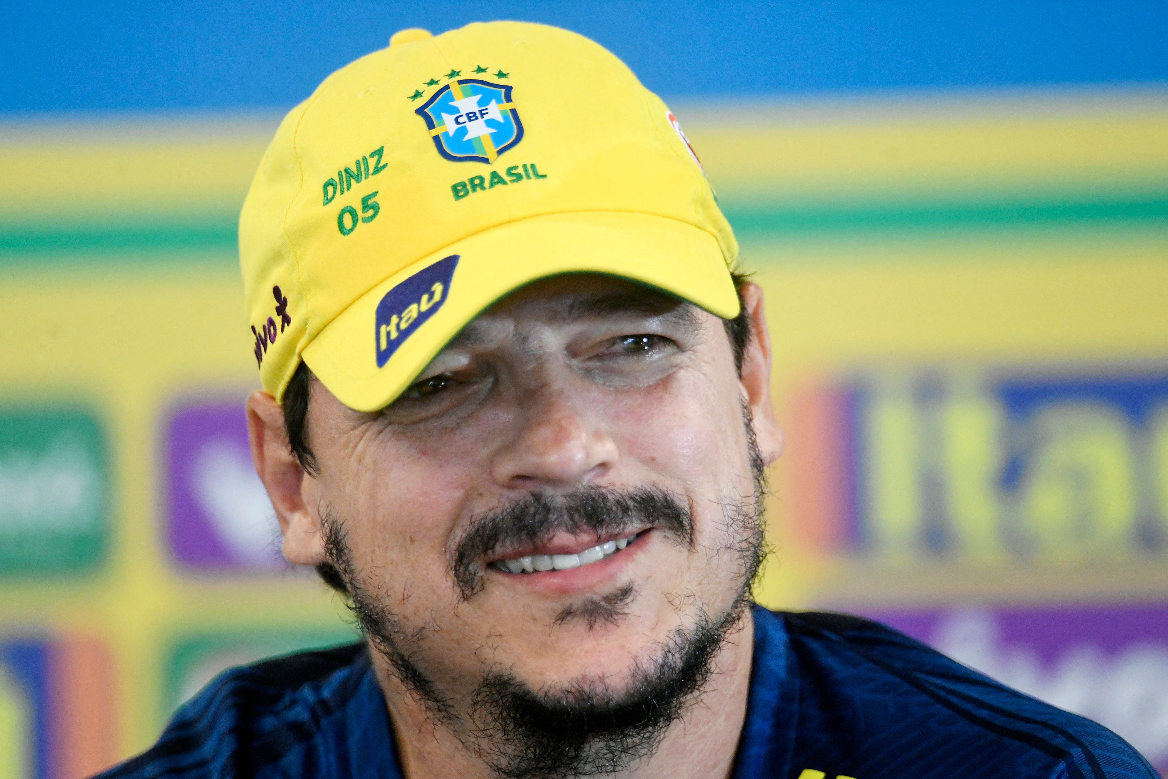Brazil's coach Fernando Diniz gestures during a press conference in Teresopolis, Brazil, on November 15, 2023, ahead of the 2026 FIFA World Cup South American qualification football matches against Colombia and Argentina, on November 16 and 21 respectively. (Photo by Daniel RAMALHO / AFP)