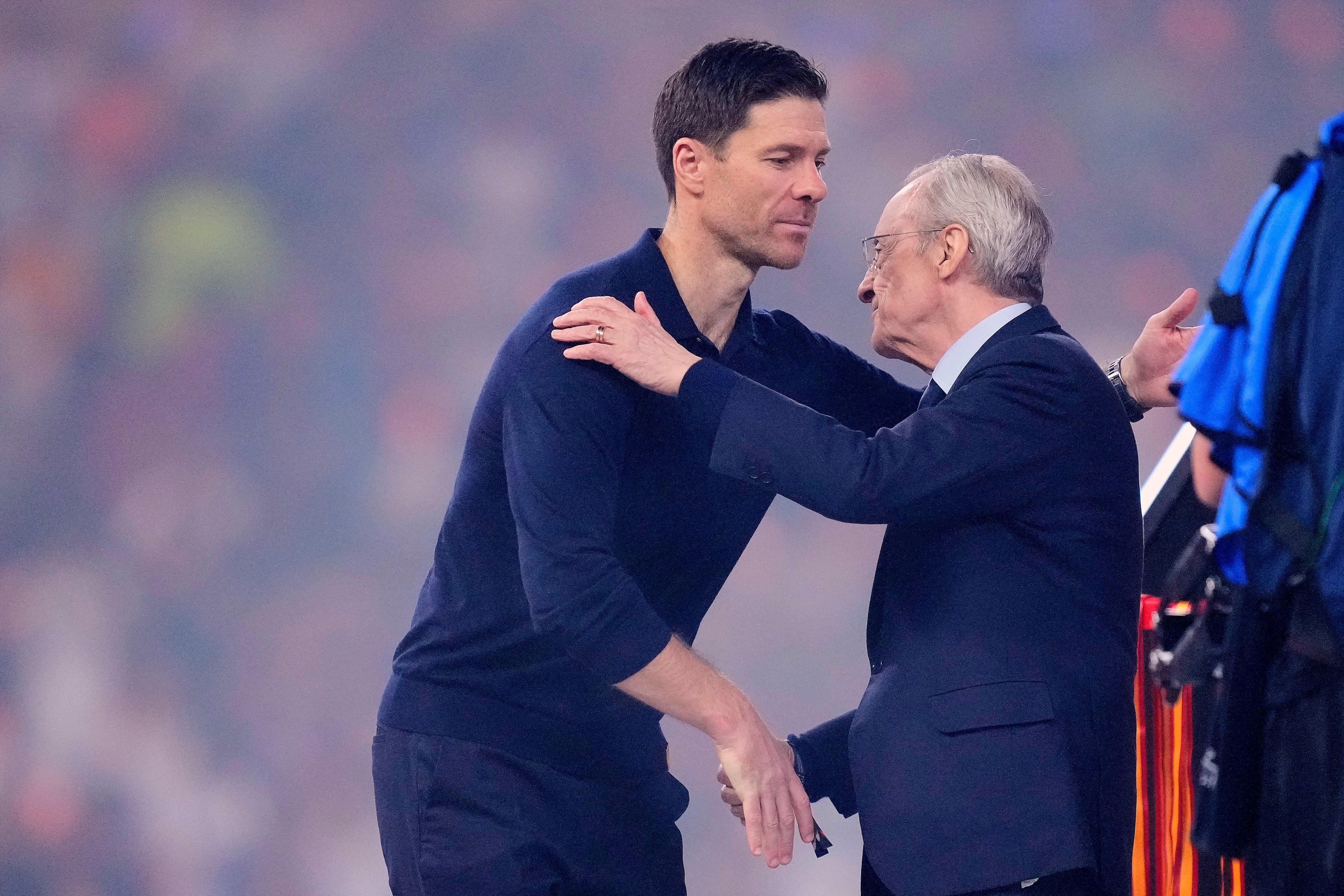 Xabi Alonso head coach of Real Madrid and Real Madrid president Florentino Perez greet after the Spanish Super Cup final match between FC Barcelona and Real Madrid at King Abdullah Sports City Hall Stadium on January 11, 2026 in Jeddah, Saudi Arabia. (Photo by Jose Breton/Pics Action/NurPhoto) (Photo by Jose Breton / NurPhoto via AFP)