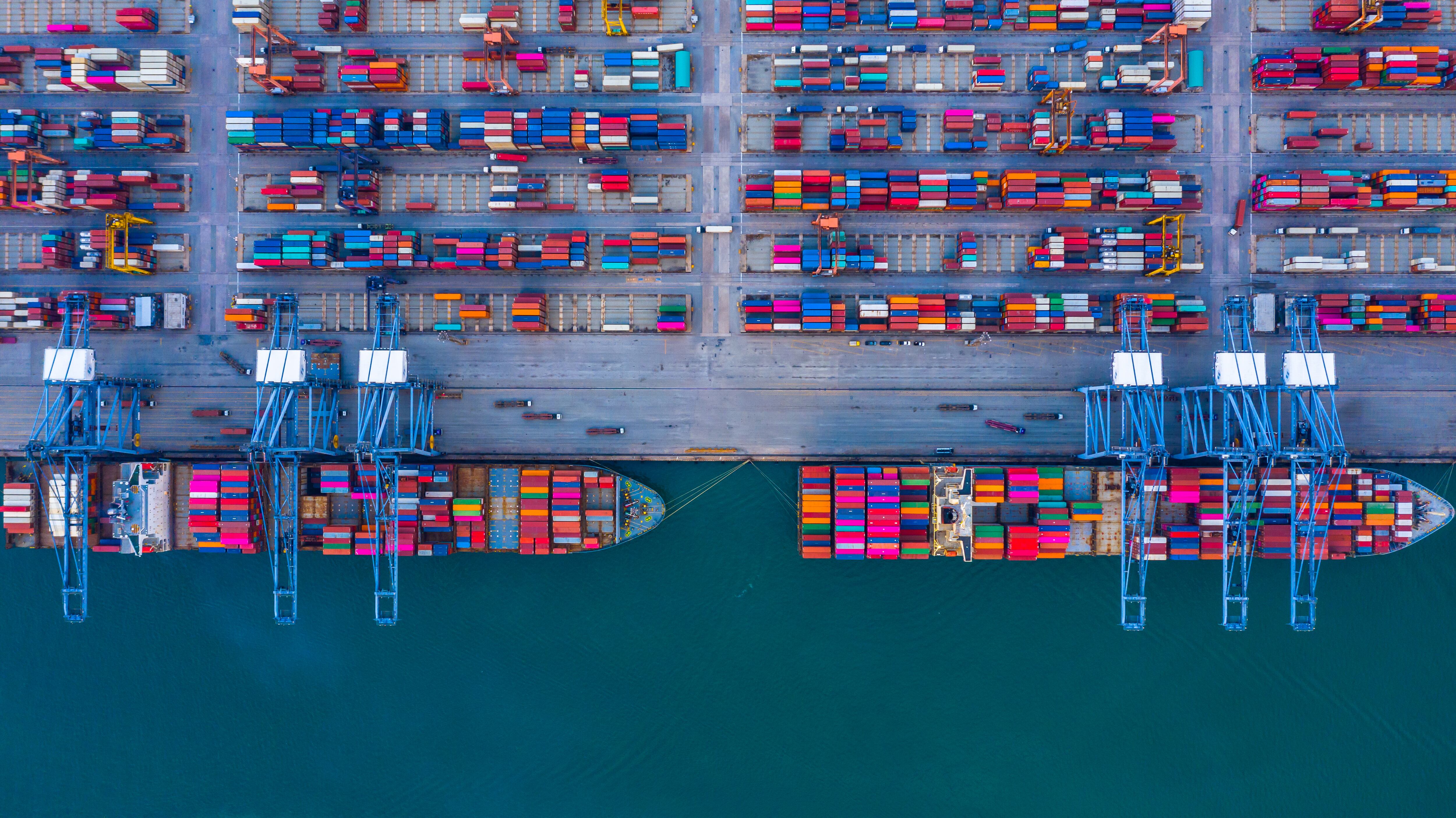Container ship is loading in a port, Aerial top view container ship.