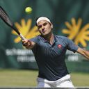 Switzerland's Roger Federer plays a forehand during his ATP Tour Singles, Men, Round of 16 tennis match against Canada's Felix Auger-Aliassime in Halle, Germany, Wednesday, June 16, 2021. (Friso Gentsch/dpa via AP)