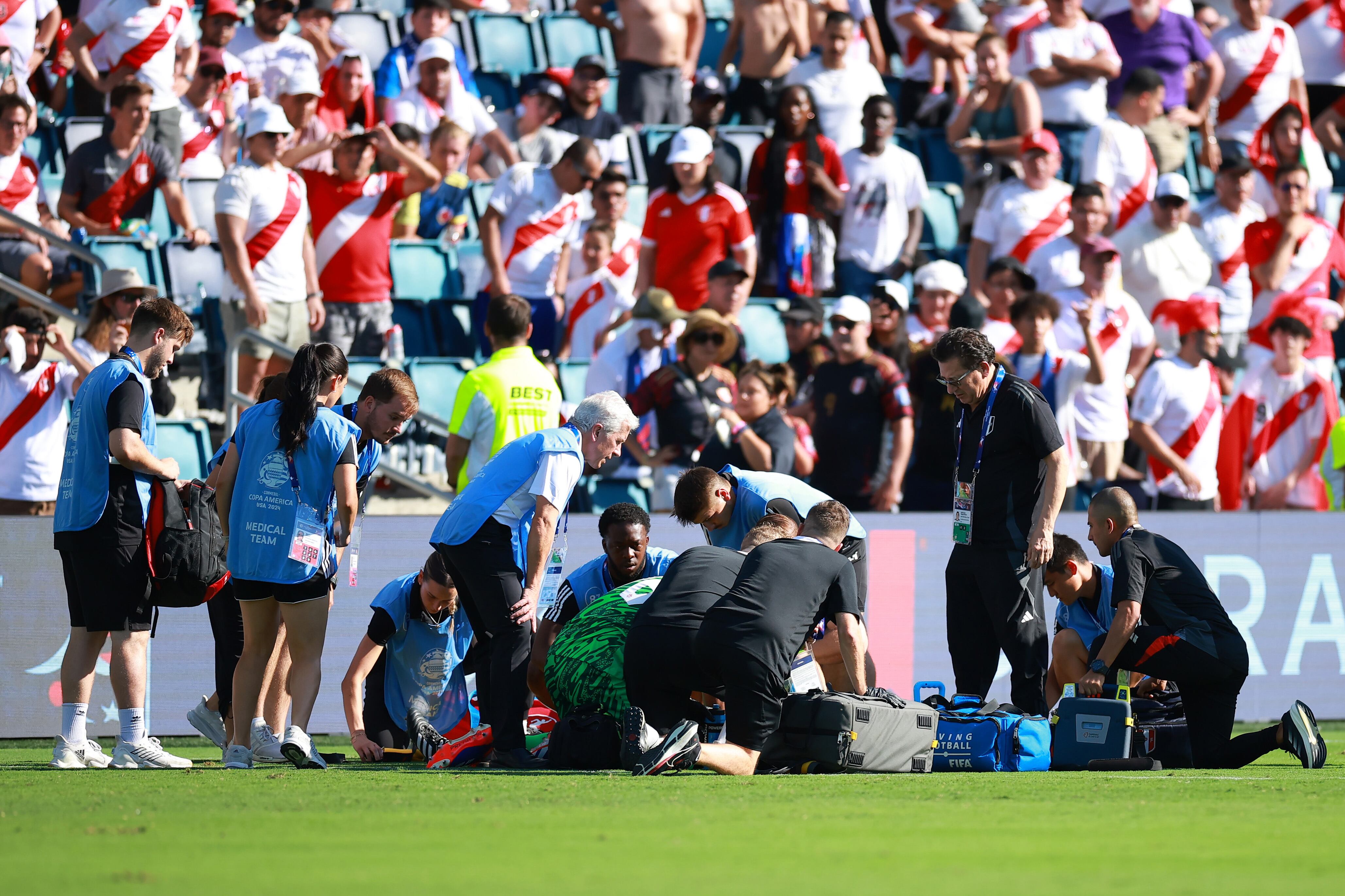 KANSAS CITY, KANSAS - JUNE 25: Medics assist assistant referee Humberto Panjoj during the CONMEBOL Copa America 2024 between Peru and Canada at Children's Mercy Park on June 25, 2024 in Kansas City, Kansas. (Photo by Hector Vivas/Getty Images)