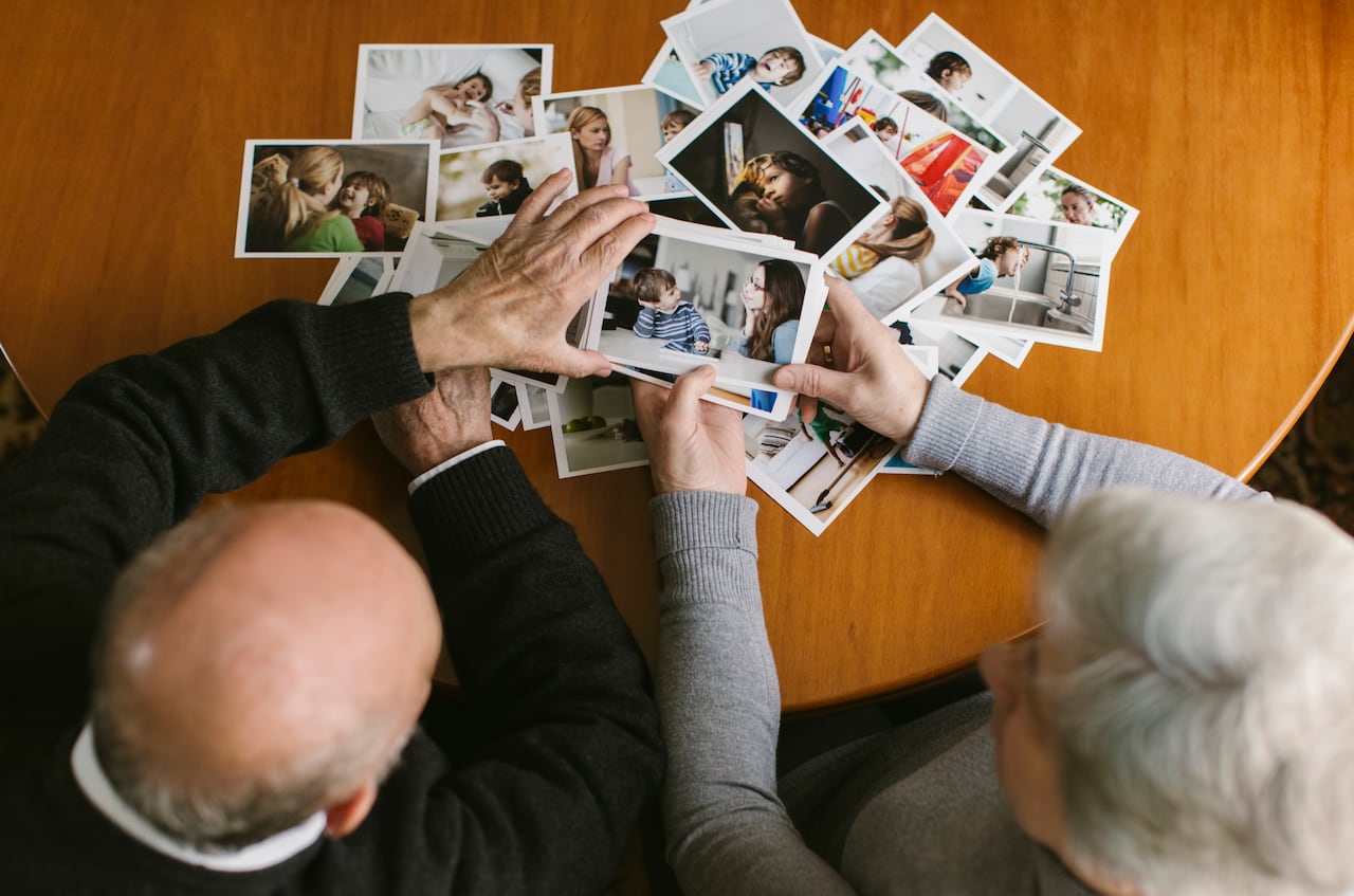 Senior couple looking at photos