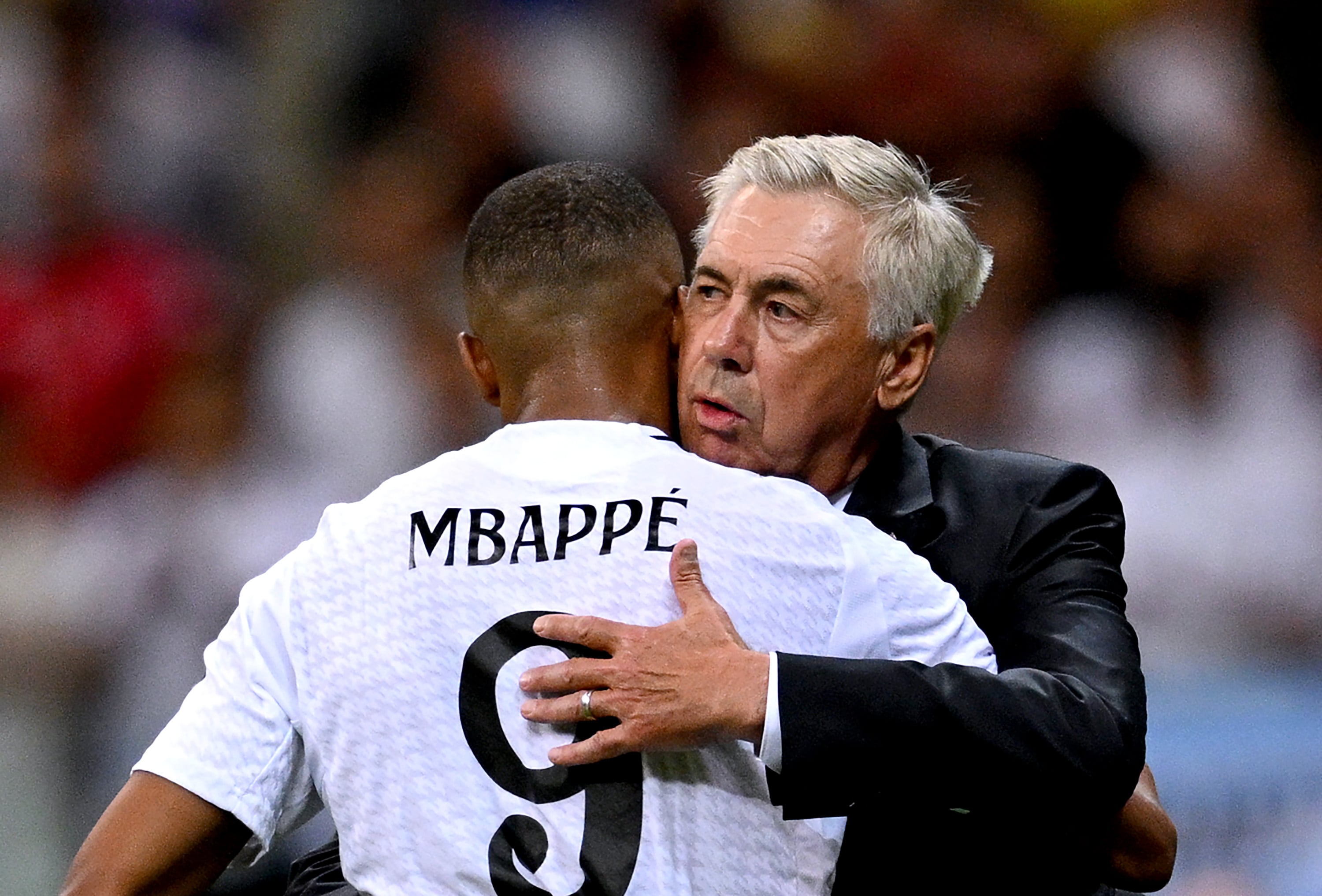 WARSAW, POLAND - AUGUST 14: Kylian Mbappe of Real Madrid is embraced by Carlo Ancelotti, Head Coach of Real Madrid, after being substituted during the UEFA Super Cup 2024 match between Real Madrid and Atalanta BC at National Stadium on August 14, 2024 in Warsaw, Poland. (Photo by Tullio Puglia - UEFA/UEFA via Getty Images)