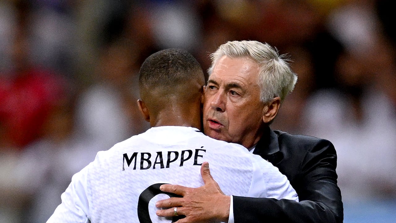 WARSAW, POLAND - AUGUST 14: Kylian Mbappe of Real Madrid is embraced by Carlo Ancelotti, Head Coach of Real Madrid, after being substituted during the UEFA Super Cup 2024 match between Real Madrid and Atalanta BC at National Stadium on August 14, 2024 in Warsaw, Poland. (Photo by Tullio Puglia - UEFA/UEFA via Getty Images)