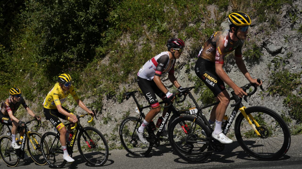 Belgium's Tiesj Benoot, Spain's Marc Soler, Slovenia's Tadej Pogacar, wearing the overall leader's yellow jersey, and Denmark's Jonas Vingegaard climb Col du Galibier pass during the eleventh stage of the Tour de France cycling race over 152 kilometers (94.4 miles) with start in Albertville and finish in Col du Granon Serre Chevalier, France, Wednesday, July 13, 2022. (AP/Thibault Camus)