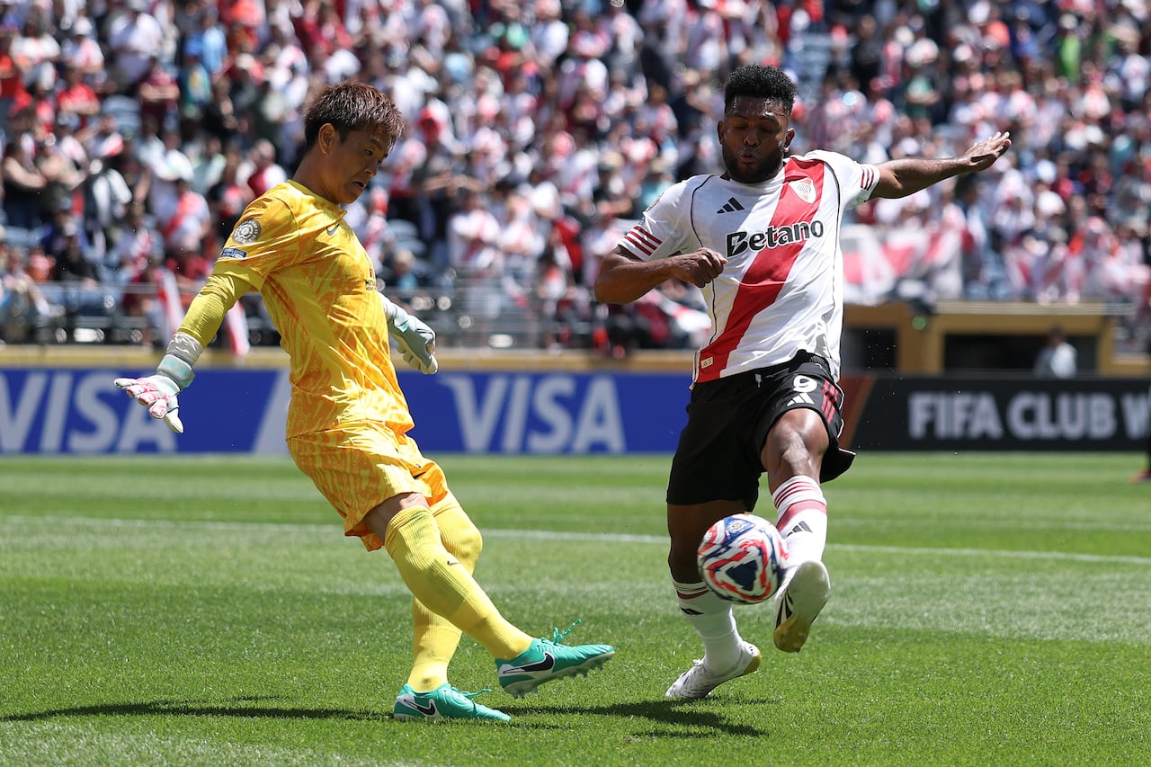 Miguel Borja #9 of River Plate is challenged by Shusaku Nishikawa #1 of Urawa Red Diamonds during the FIFA Club World Cup 2025 group E, at Lumen Field of Seattle, Washington.