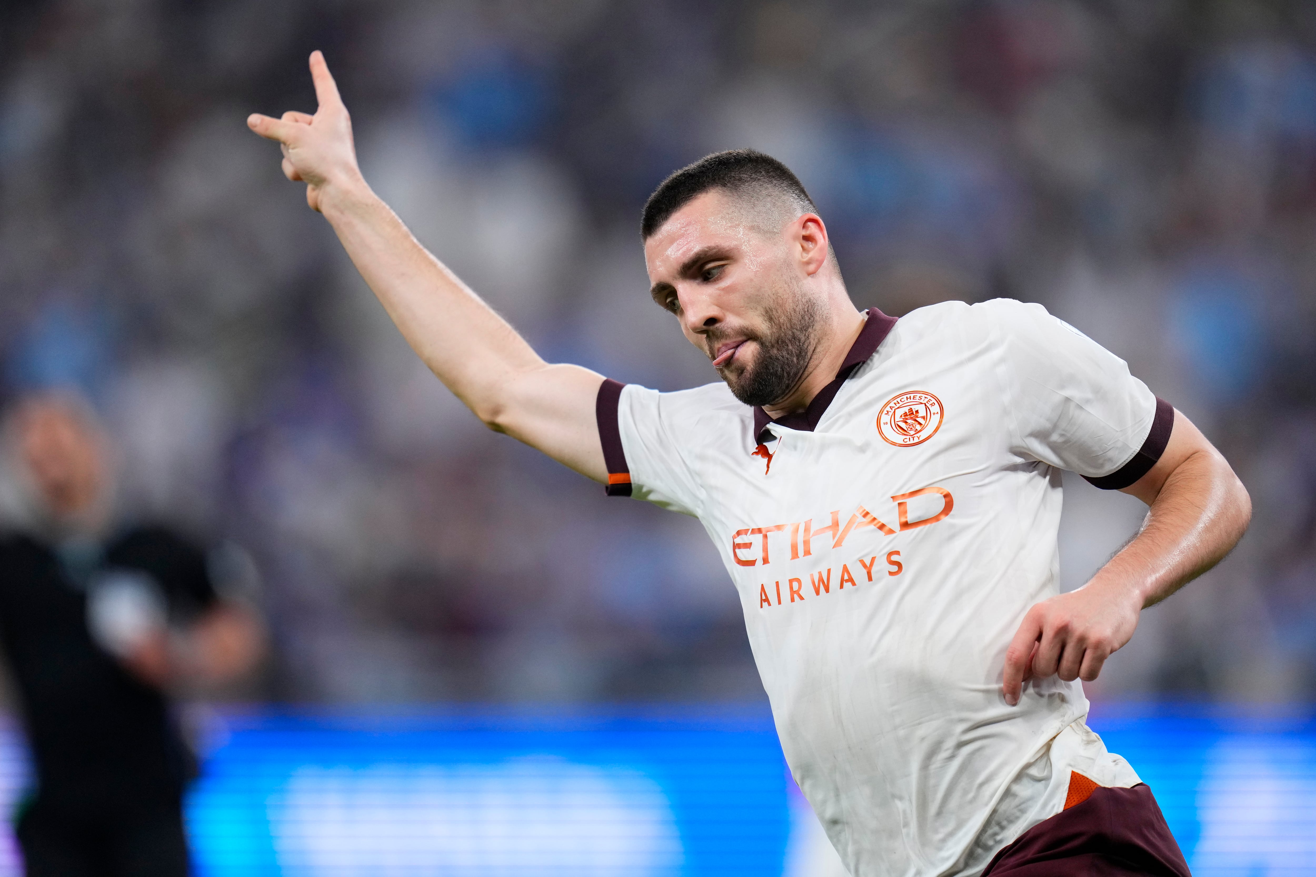 Manchester City's Mateo Kovacic celebrates after scoring his side's second goal during the Soccer Club World Cup semifinal soccer match between Urawa Reds and Manchester City FC at King Abdullah Sports City Stadium in Jeddah, Saudi Arabia, Tuesday, Dec. 19, 2023. (AP Photo/Manu Fernandez)