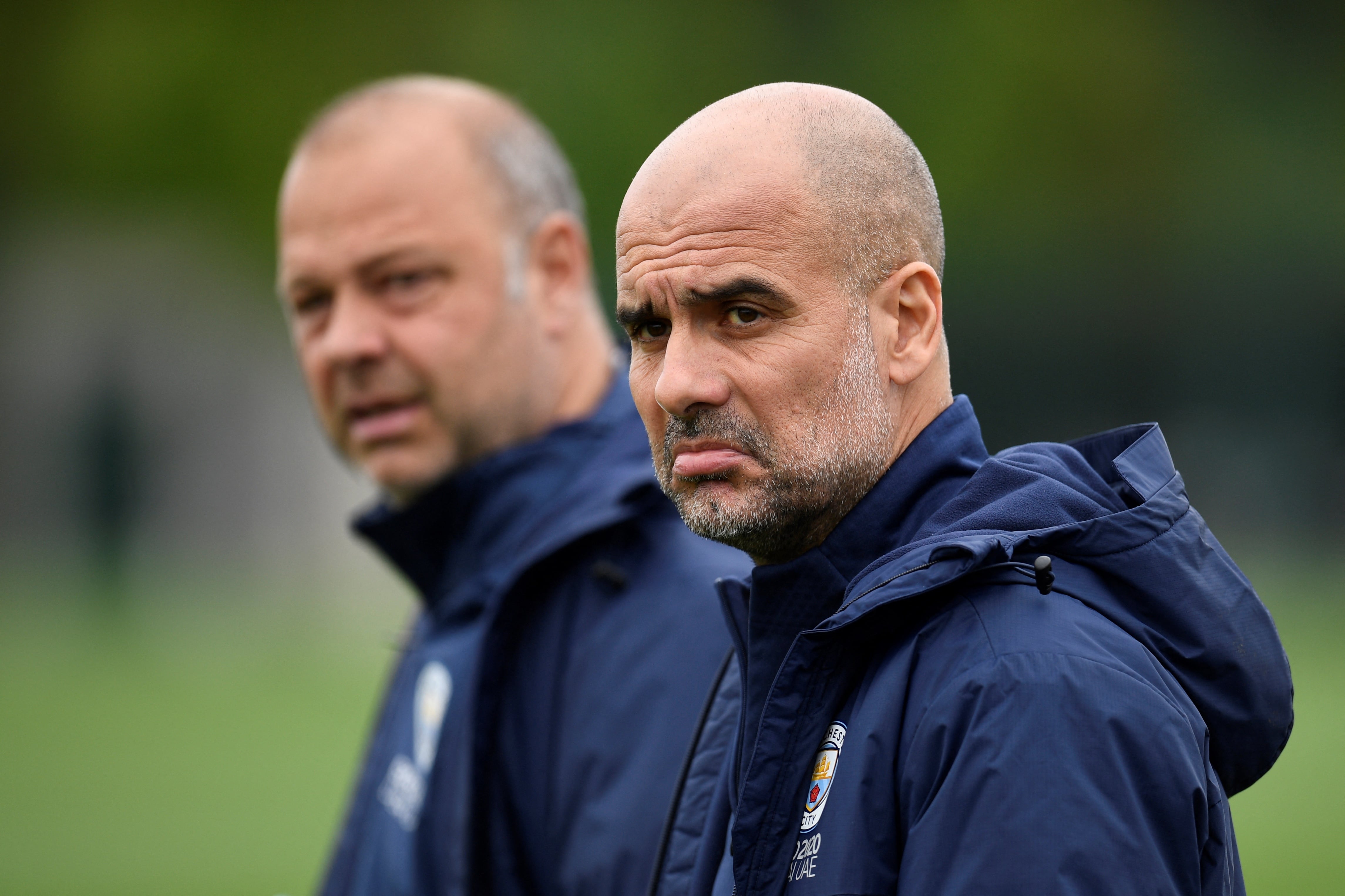 Manchester City's Spanish manager Pep Guardiola reacts as he arrives to take part in a training session at the Manchester City training ground in Manchester, north west England, on May 3, 2022, on the eve of their UEFA Champions League semi-final second leg football match against Real Madrid. (Photo by Oli SCARFF / AFP)