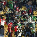 Fans of the Independiente Santa Fe and Atletico Nacional teams clash inside the Nemesio Camacho El Campin stadium during its reopening to the public after being closed by the Covid-19 pandemic in Bogota on August 3, 2021. (Photo by Daniel Garzon / AFP)