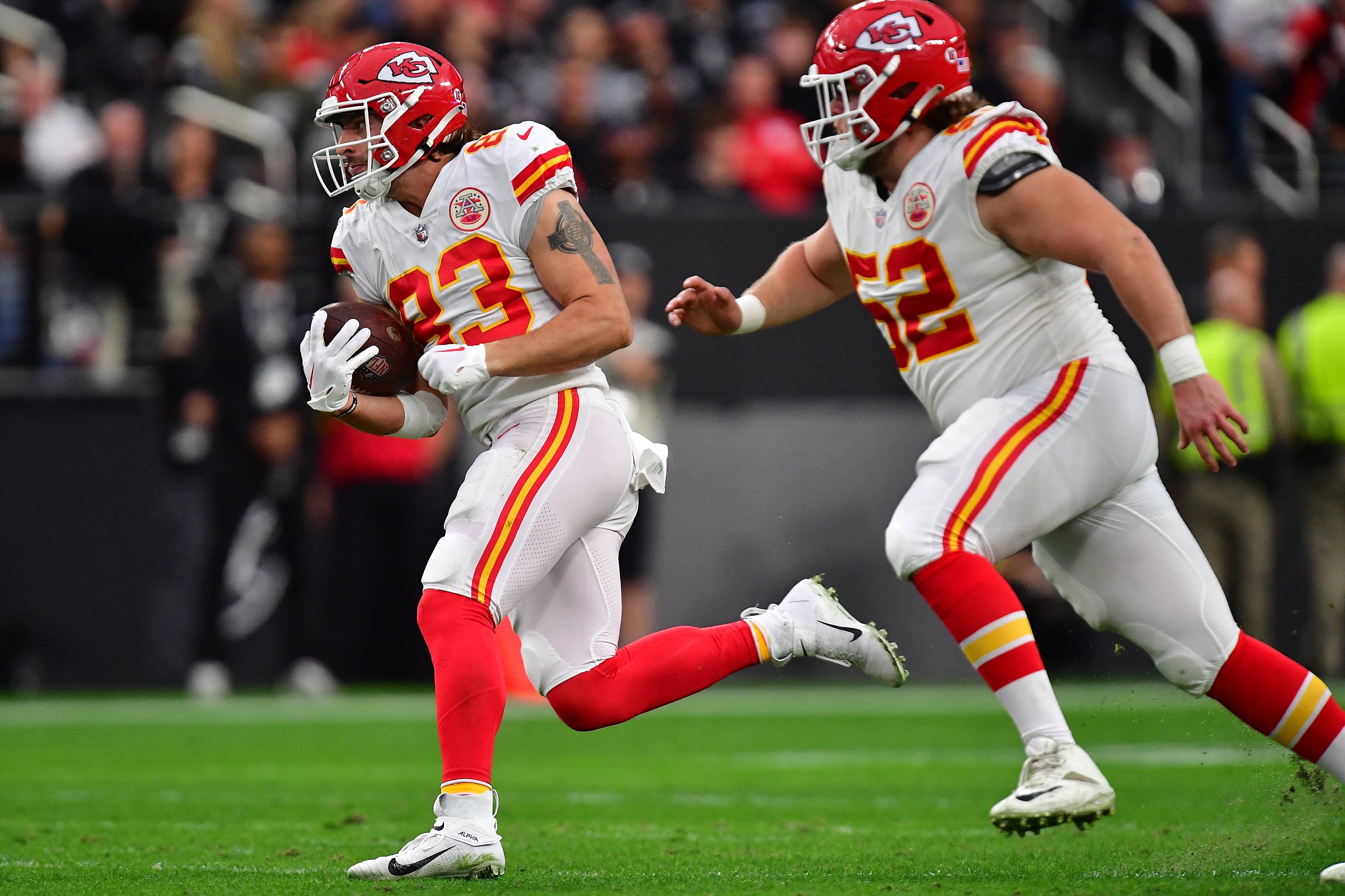 Jan 7, 2023; Paradise, Nevada, USA; Kansas City Chiefs tight end Noah Gray (83) runs the ball against the Las Vegas Raiders during the first half at Allegiant Stadium. Mandatory Credit: Gary A. Vasquez-USA TODAY Sports