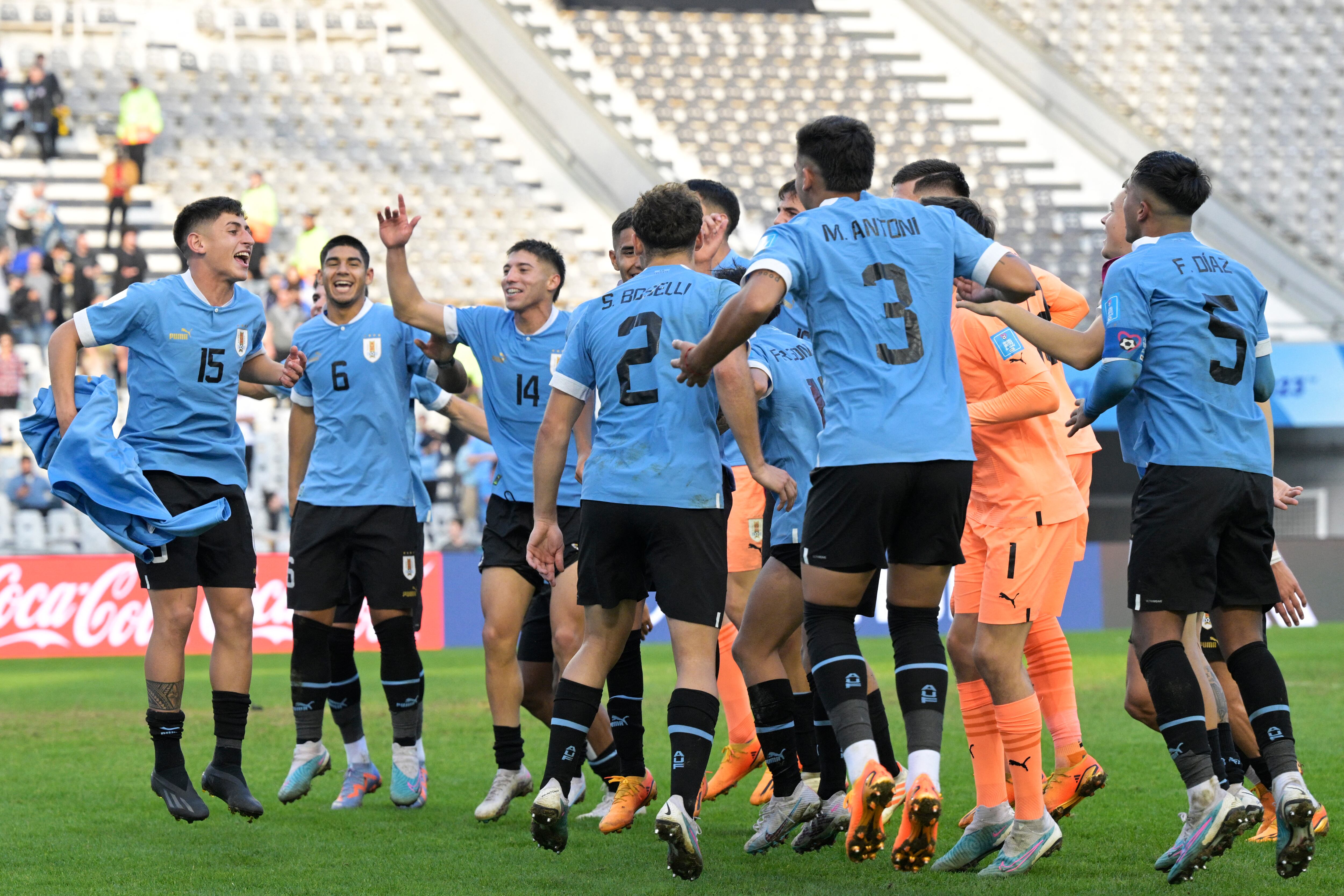 Uruguayan players celebrate after defeating Israel in the Argentina 2023 U-20 World Cup semi-final match between Uruguay and Israel at the Estadio Unico Diego Armando Maradona stadium in La Plata, Argentina, on June 8, 2023. Uruguay won 1-0 and advanced to the final of the tournament. (Photo by JUAN MABROMATA / AFP)
