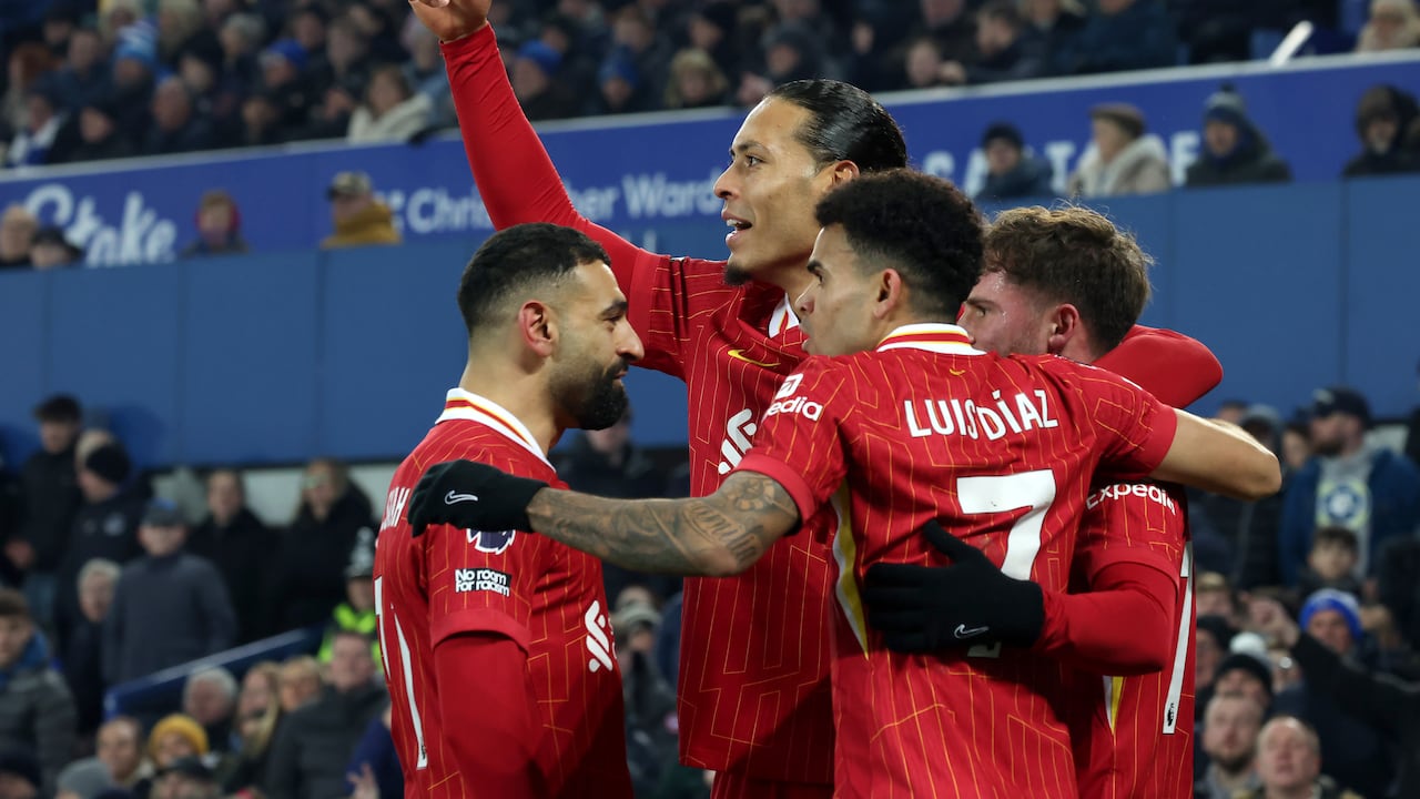 LIVERPOOL, ENGLAND - FEBRUARY 12: (THE SUN OUT, THE SUN ON SUNDAY OUT) Alexis Mac Allister of Liverpool celebrates with teammates Mohamed Salah, Virgil van Dijk and Luis Diaz after scoring his team's first goal during the Premier League match between Everton FC and Liverpool FC at Goodison Park on February 12, 2025 in Liverpool, England. (Photo by Liverpool FC/Liverpool FC via Getty Images)