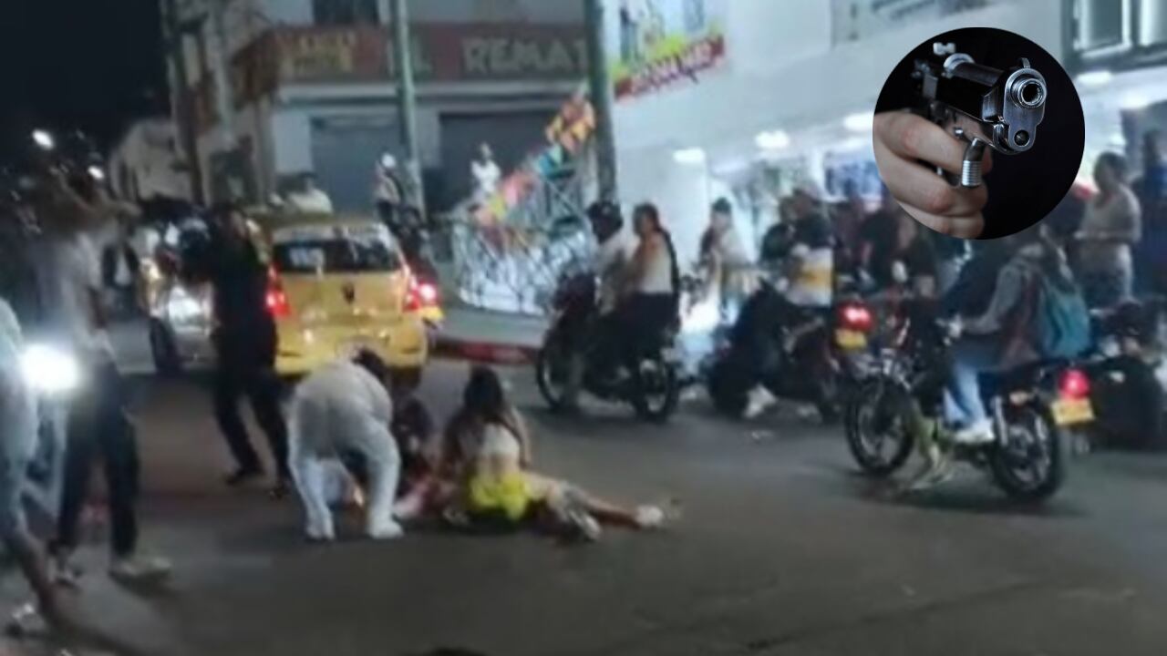 Personas auxilian a la víctima después de los disparos que recibió.