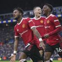 Manchester United's Fred, left, celebrates after scoring his side's third goal during the English Premier League soccer match between Leeds United and Manchester United, at Elland Road Stadium in Leeds, England, Sunday, Feb. 20, 2022. (AP/Jon Super)