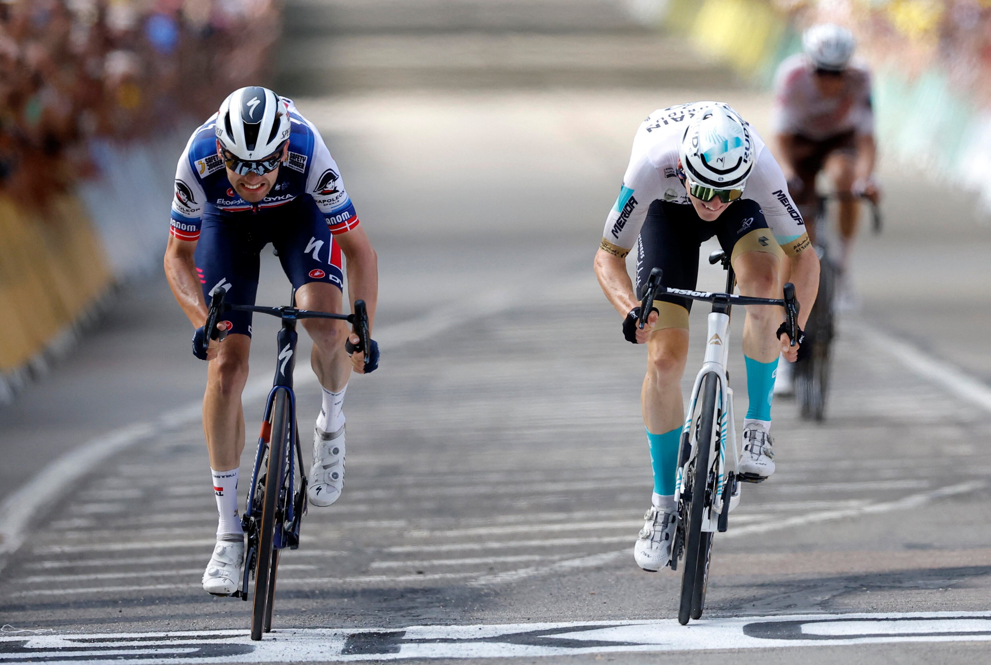 Cycling - Tour de France - Stage 19 - Moirans-En-Montagne to Poligny - France - July 21, 2023 Team Bahrain Victorious' Matej Mohoric crosses the finish line to win alongside Soudal–Quick-Step's Kasper Asgreen after stage 19 REUTERS/Stephane Mahe