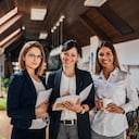 Group portrait of confident female business team.