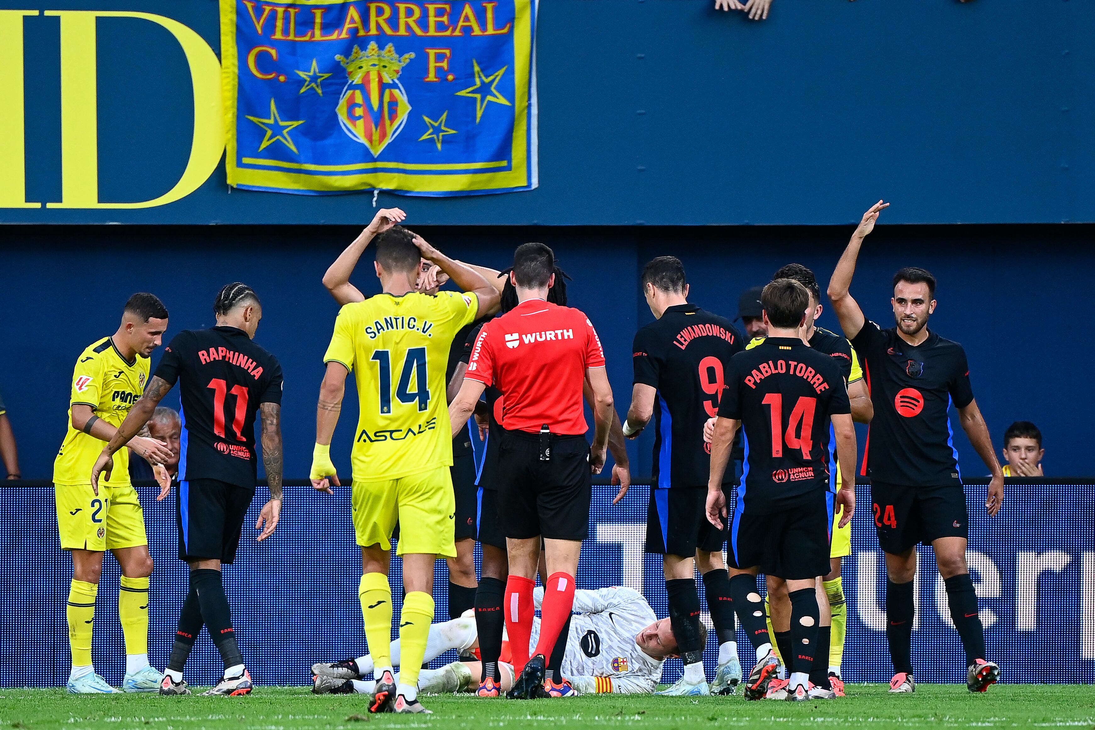 Barcelona's German goalkeeper #01 Marc-Andre Ter Stegen receives medical assistance during the Spanish league football match between Villarreal CF and FC Barcelona at La Ceramica stadium in Vila-real, on September 22, 2024. (Photo by JOSE JORDAN / AFP)
