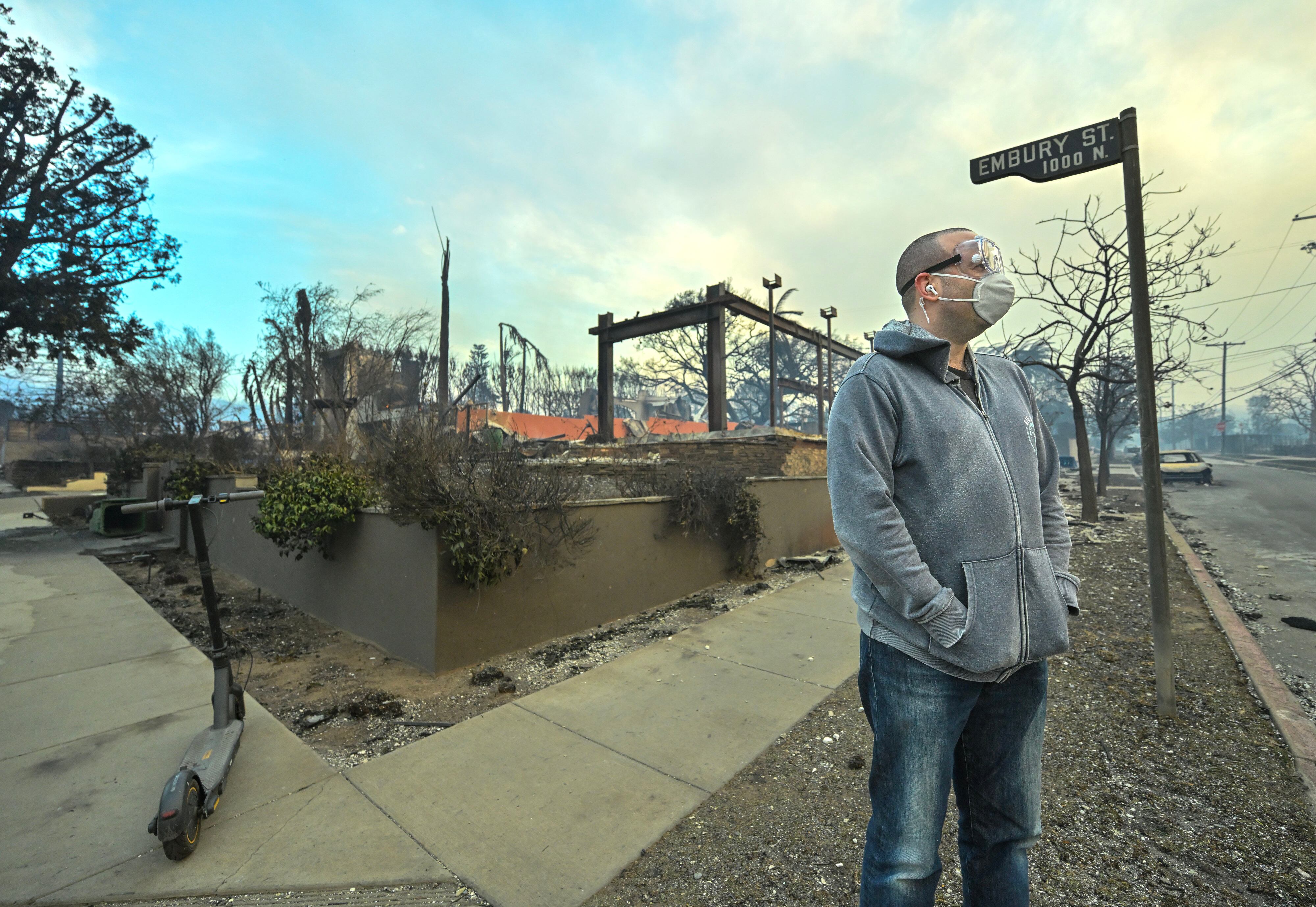 PCIFIC PALISADES, CA - January 08: Jason Blundell surveys his neighborhood as he stands next to his burned home on Embury Street during the Palisades Fire on Wednesday, January 8, 2025, in Pacific Palisades, CA. 
(Photo by Jeff Gritchen/MediaNews Group/Orange County Register via Getty Images)