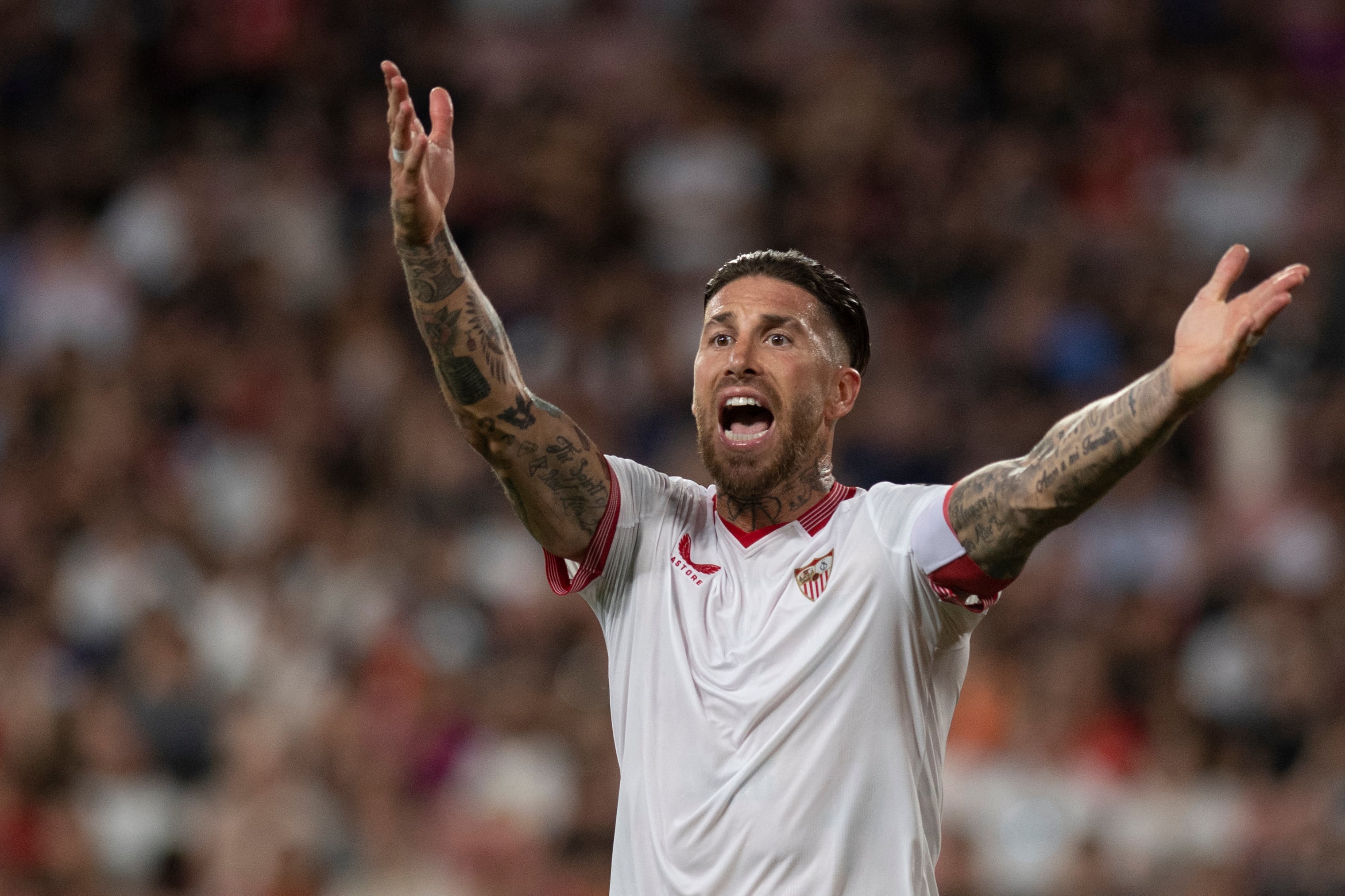 (FILES) Sevilla's Spanish defender #4 Sergio Ramos reacts during the Spanish league football match between Sevilla FC and FC Barcelona at the Ramon Sanchez Pizjuan stadium in Seville on May 26, 2024. Veteran Spanish defender Sergio Ramos has told hometown club Sevilla his second stint with them is over after just one season, the La Liga outfit said on June 17, 2024. (Photo by JORGE GUERRERO / AFP)