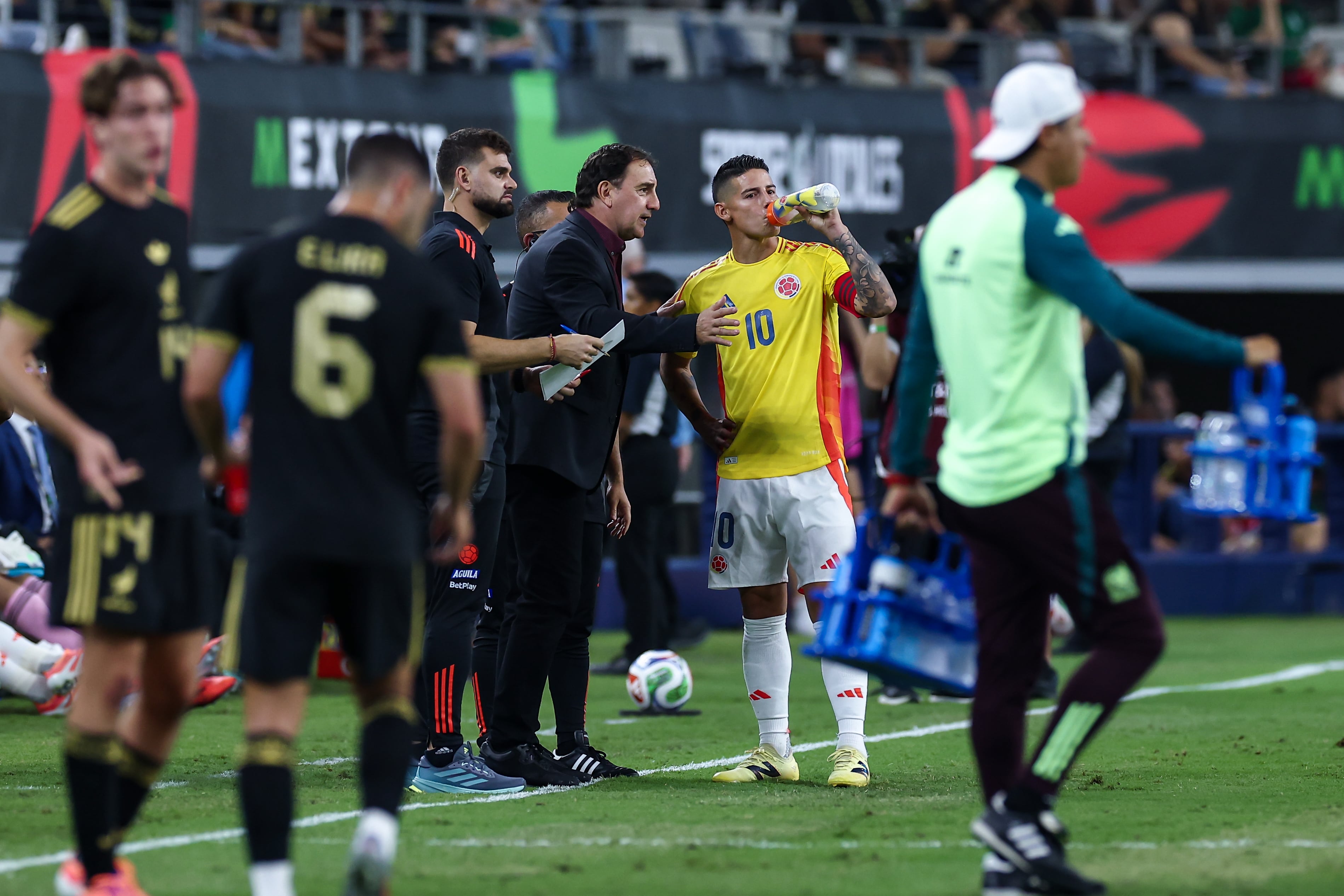 ARLINGTON, TX - October 11: Colombia midfielder James Rodriguez (#10) listens to Colombia head coach Nestor Lorenzo during a break in the action during the soccer match between Mexico and Colombia on October 11, 2025, at AT&T Stadium in Arlington TX.  (Photo by Matthew Visinsky/Icon Sportswire via Getty Images)