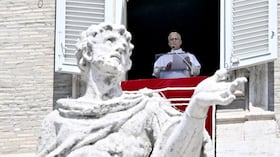 Pope Leo XIV speaks during his Angelus prayer from a balcony overlooking St. Peter's Square at the Vatican, on August 9, 2026. (Photo by Filippo MONTEFORTE / AFP)