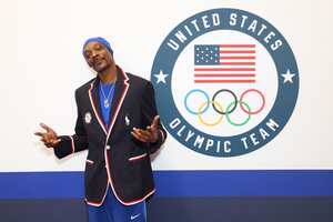 PARIS, FRANCE - JULY 21: Snoop Dogg tries on clothes during Team USA Welcome Experience ahead of Paris 2024 Summer Olympics at Polo Ralph Lauren on July 21, 2024 in Paris, France. (Photo by Joe Scarnici/Getty Images for USOPC)