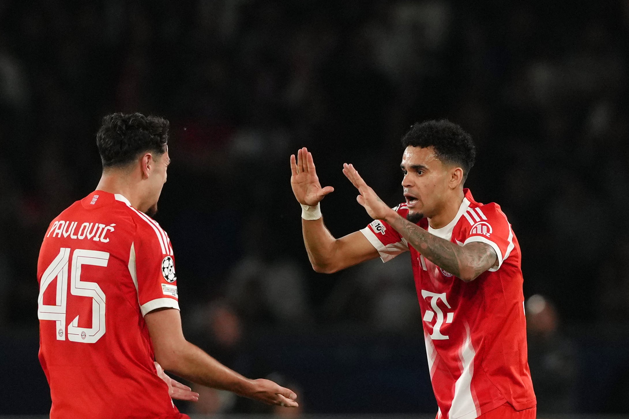 Bayern's Luis Diaz celebrates with Aleksandar Pavlovic after scoring his side's fourth goal during a Champions League semifinal, first leg, soccer match between Paris Saint-Germain and Bayern Munich in Paris, Tuesday, April 28, 2026. (AP Photo/Aurelien Morissard)