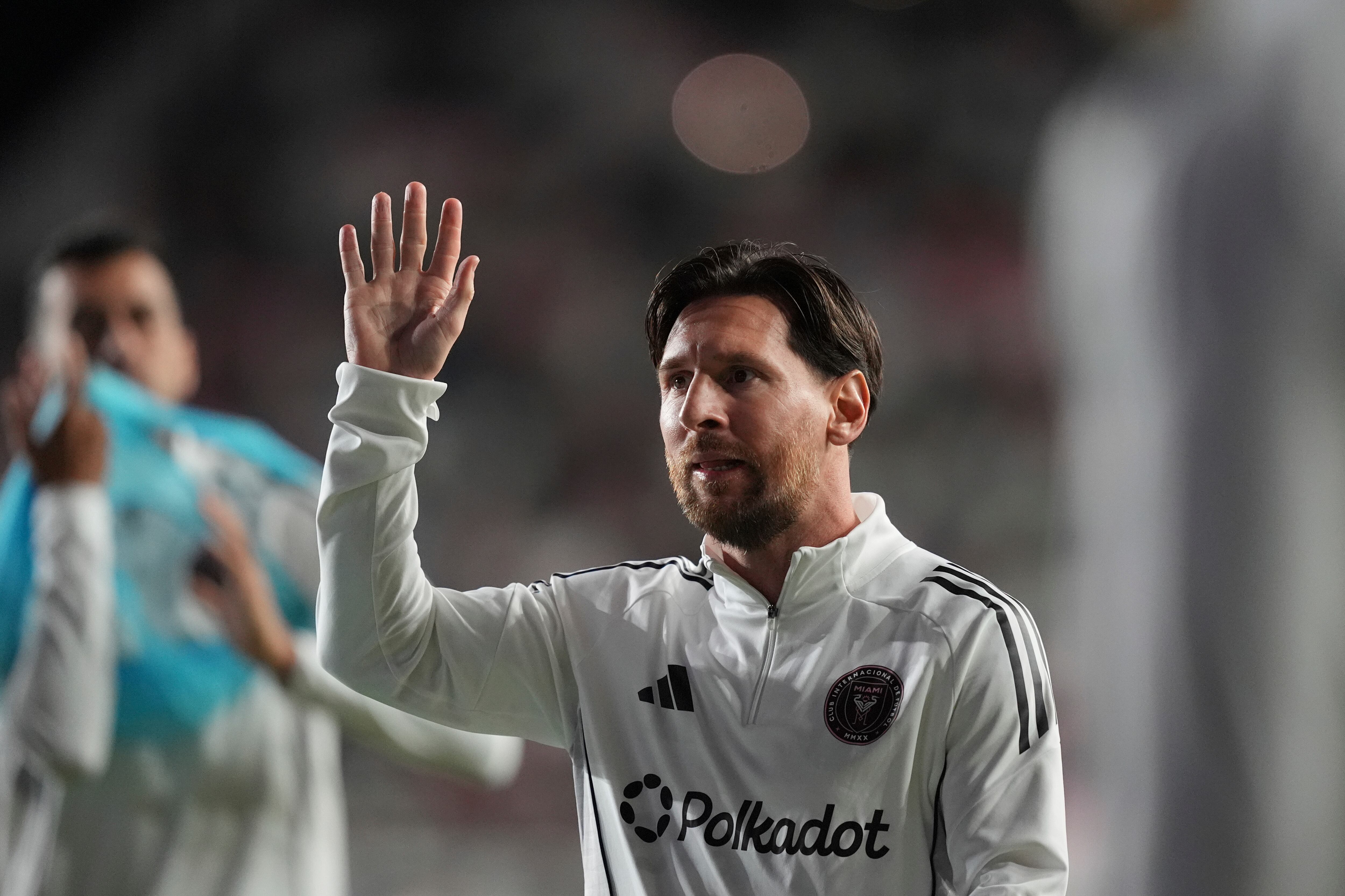 Inter Miami forward Lionel Messi waves to fans during warmup ahead of an MLS soccer match against New York City FC, Saturday, Feb. 22, 2025, in Fort Lauderdale, Fla. (AP Photo/Rebecca Blackwell)