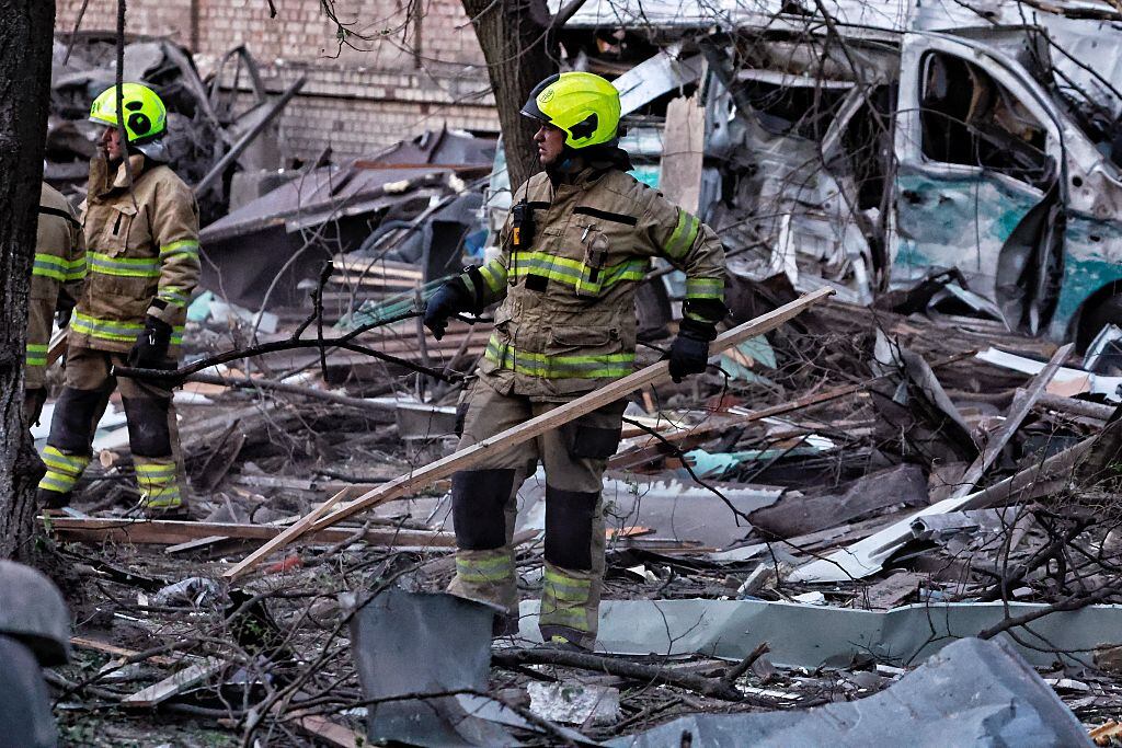 KYIV, UKRAINE - APRIL 24: Rescue workers respond at the site of a Russian missile strike on apartment residential buildings in Svyatoshynskyi district on April 24, 2025 in Kyiv, Ukraine. In the early morning, Russia has launched a mass combined attack on the Ukrainian capital, and other cities of Ukraine. The strike on Kyiv resulted in the destruction of multi-story residential buildings, damage to administrative buildings, and non-residential buildings. At least ten people were killed and 63 were injured, including six children. Rescue workers continue to search for people under the rubble. (Photo by Yan Dobronosov/Global Images Ukraine via Getty Images)