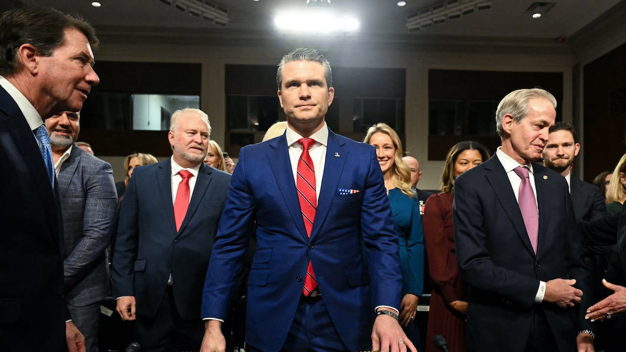 Pete Hegseth (C), US President-elect Donald Trump's nominee for Defense Secretary, arrives for his confirmation hearing before the Senate Armed Services Committee on Capitol Hill on January 14, 2025 in Washington, DC. (Photo by SAUL LOEB / AFP)