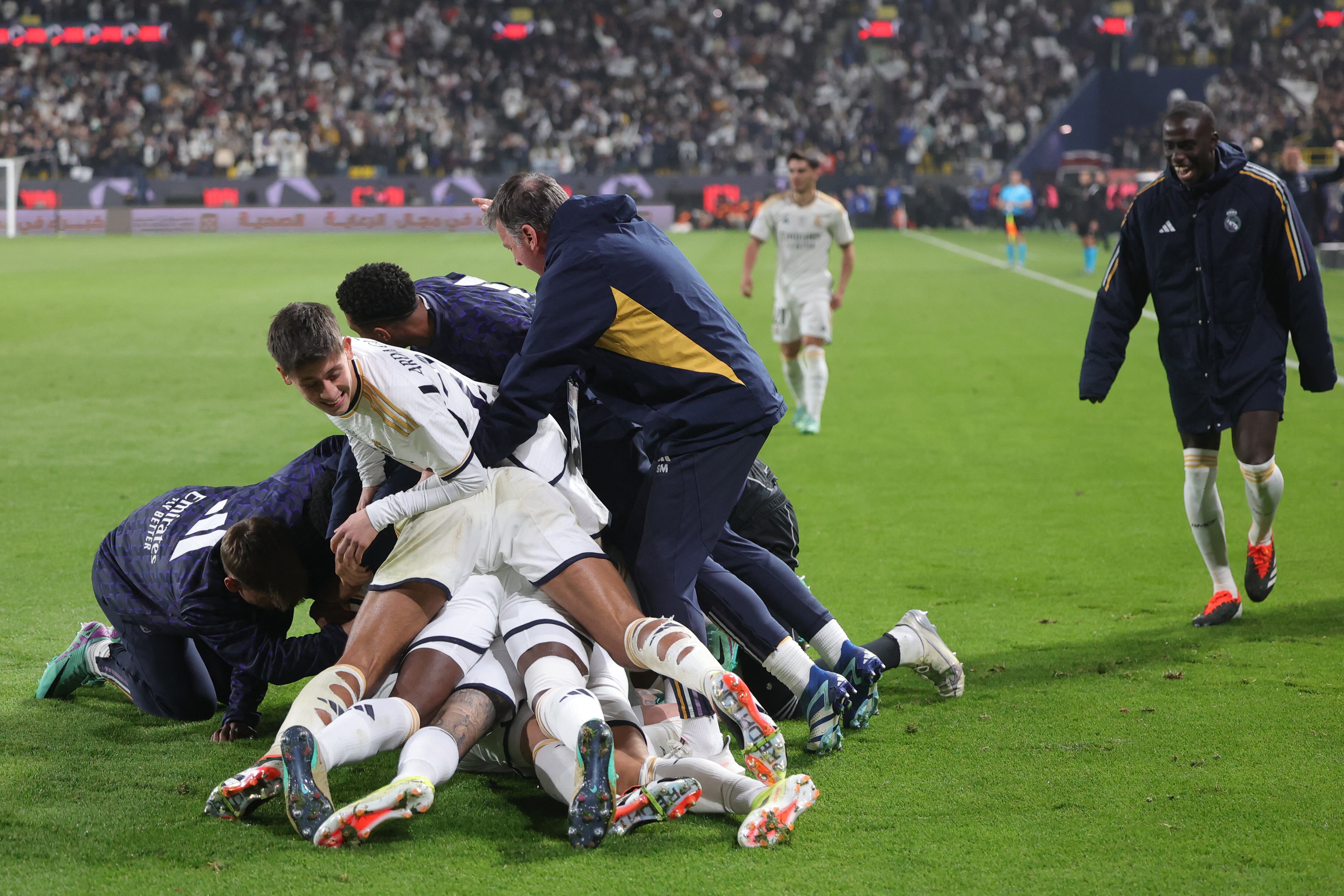 Real Madrid's players celebrate their fourth goal during the Spanish Super Cup semi-final football match between Real Madrid and Atletico Madrid at the Al-Awwal Park Stadium in Riyadh, on January 10, 2024. (Photo by Fayez NURELDINE / AFP)
