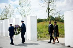 El expresidente de los Estados Unidos acompañados de su esposa Michelle Obama