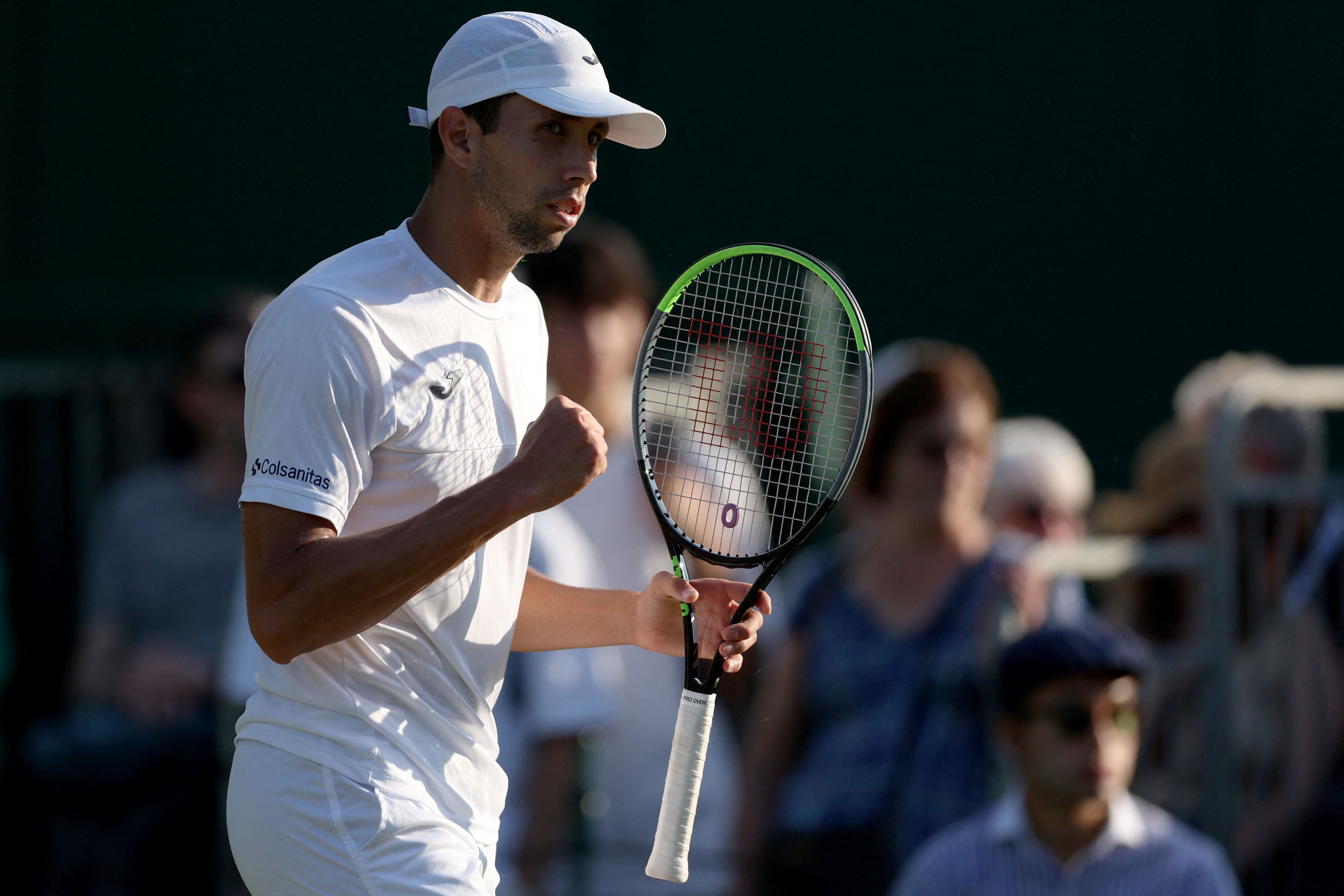 Colombia's Daniel Elahi Galan reacts as he plays against Sweden's Mikael Ymer during their men's singles tennis match on the fifth day of the 2023 Wimbledon Championships at The All England Tennis Club in Wimbledon, southwest London, on July 7, 2023. (Photo by Adrian DENNIS / AFP) / RESTRICTED TO EDITORIAL USE
